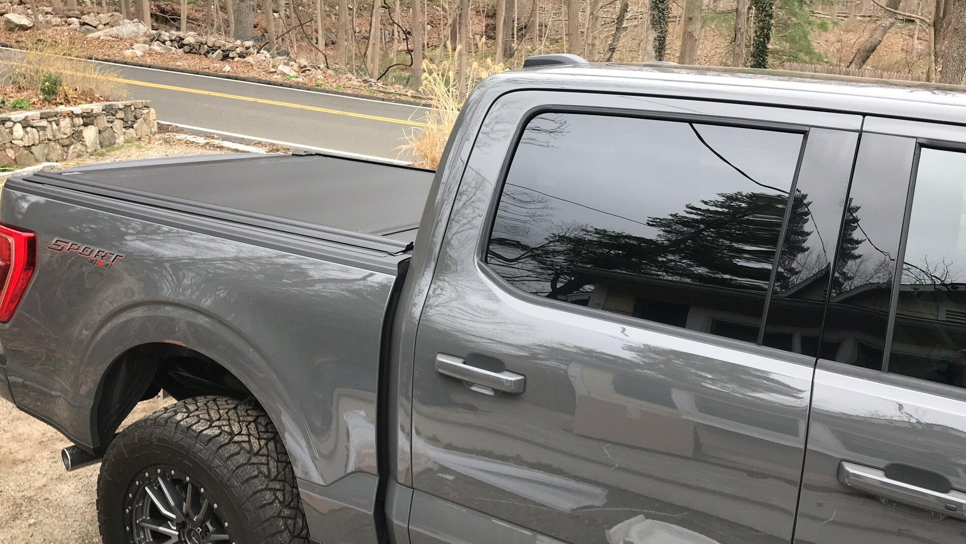 Ford F-150 Lightning Finally got my bed setup: bed liner, tonneau cover, and bed divider. 025F02BF-DB00-4028-B17F-3BA9FC7149FB