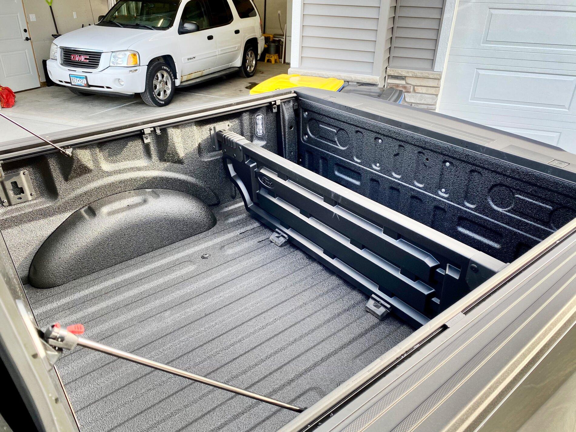 Ford F-150 Lightning Finally got my bed setup: bed liner, tonneau cover, and bed divider. 1399F4C6-B7BA-4957-B0DA-751AB52F0072