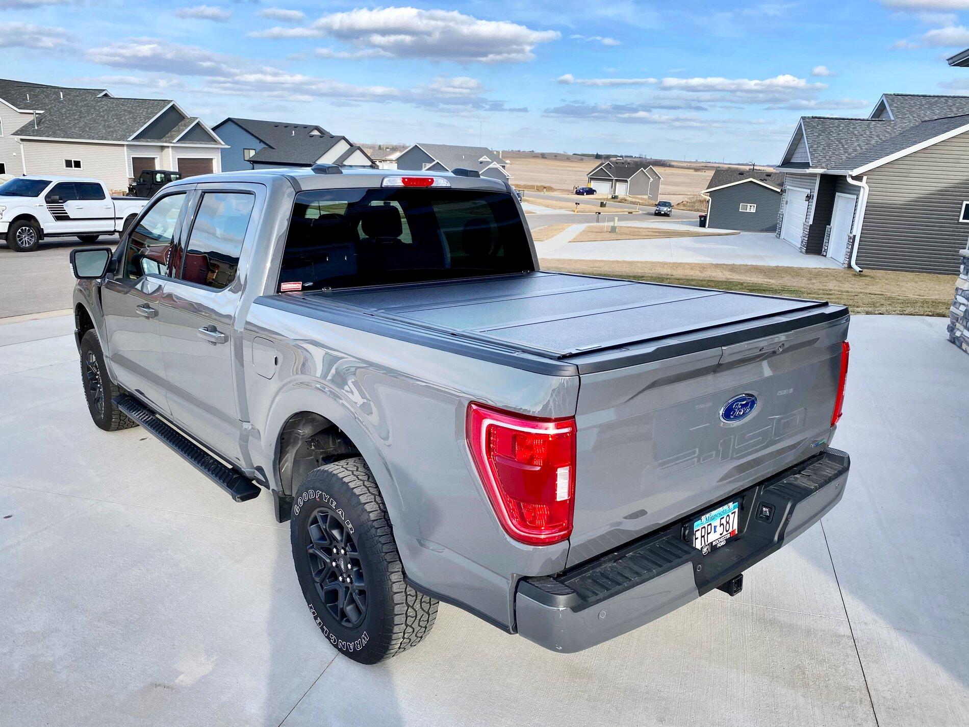 Ford F-150 Lightning Finally got my bed setup: bed liner, tonneau cover, and bed divider. 158D7FD5-2594-440B-9329-F0D2119CF8D7