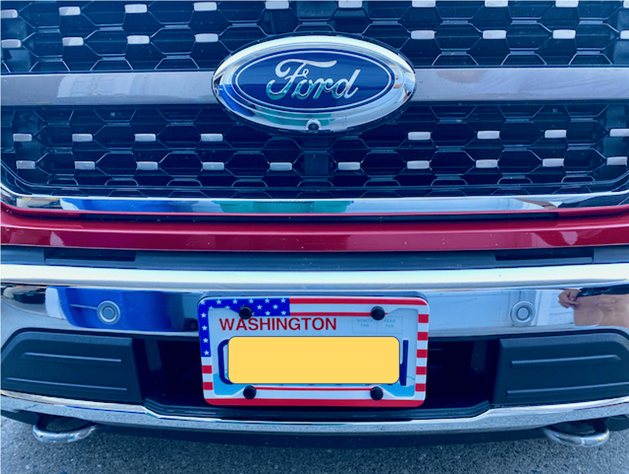 Ford F-150 Lightning How about getting that front license plate bracket off? 1625535201129
