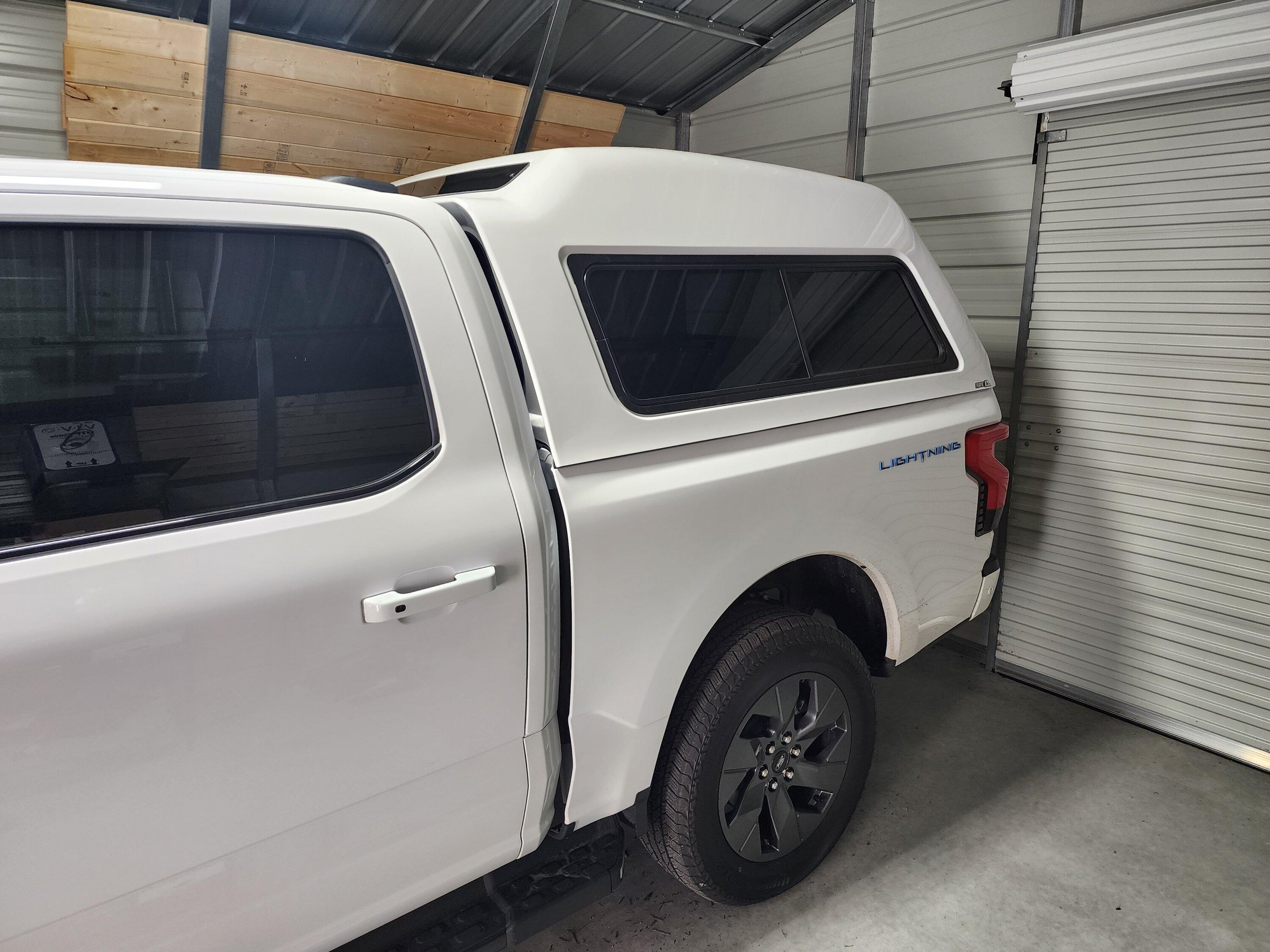 Ford F-150 Lightning A.R.E. MX truck cap camper shell installed... no noticeable effect on range so far 20230124_134655