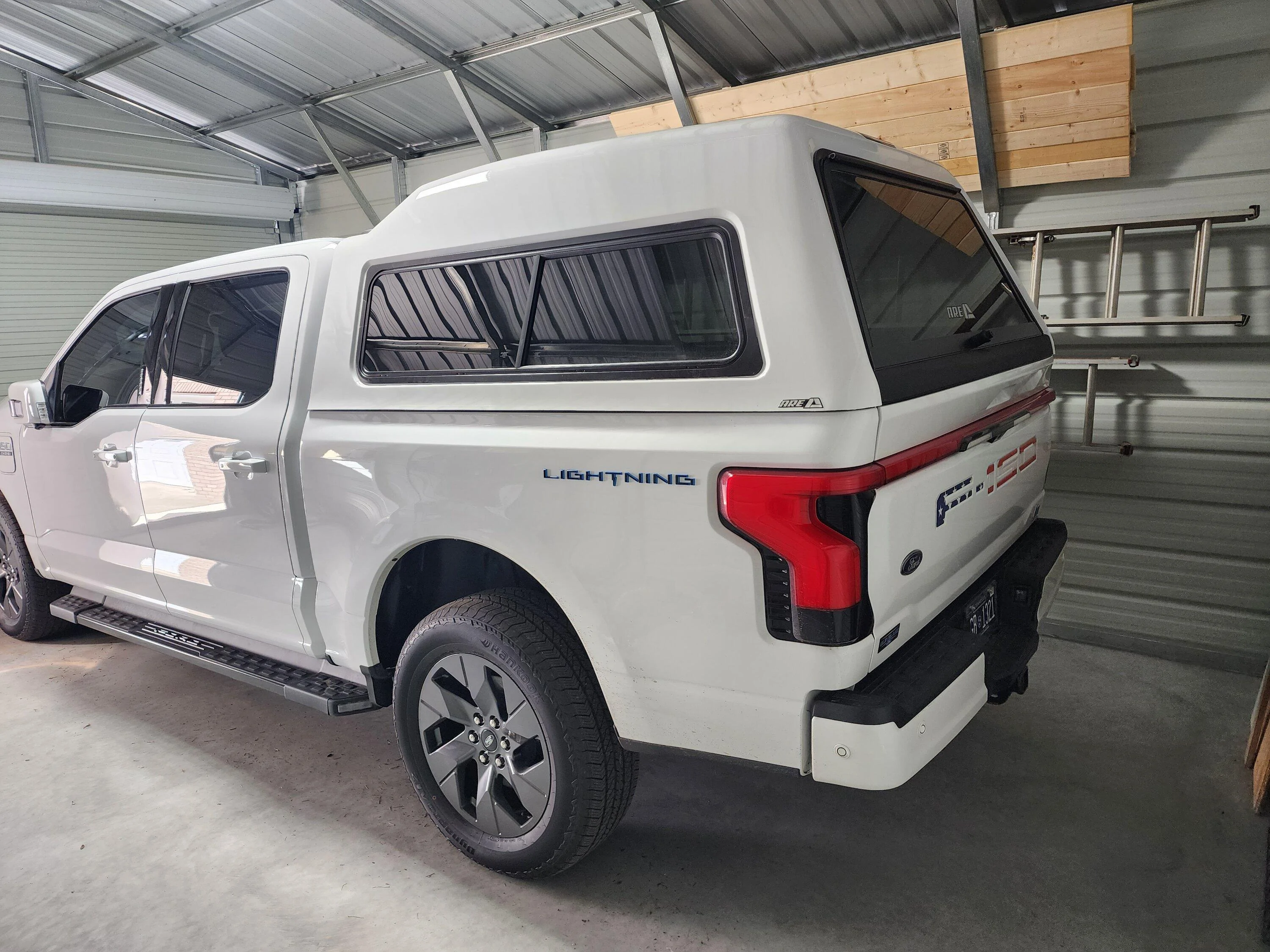 Ford F-150 Lightning A.R.E. MX truck cap camper shell installed... no noticeable effect on range so far 20230124_134711