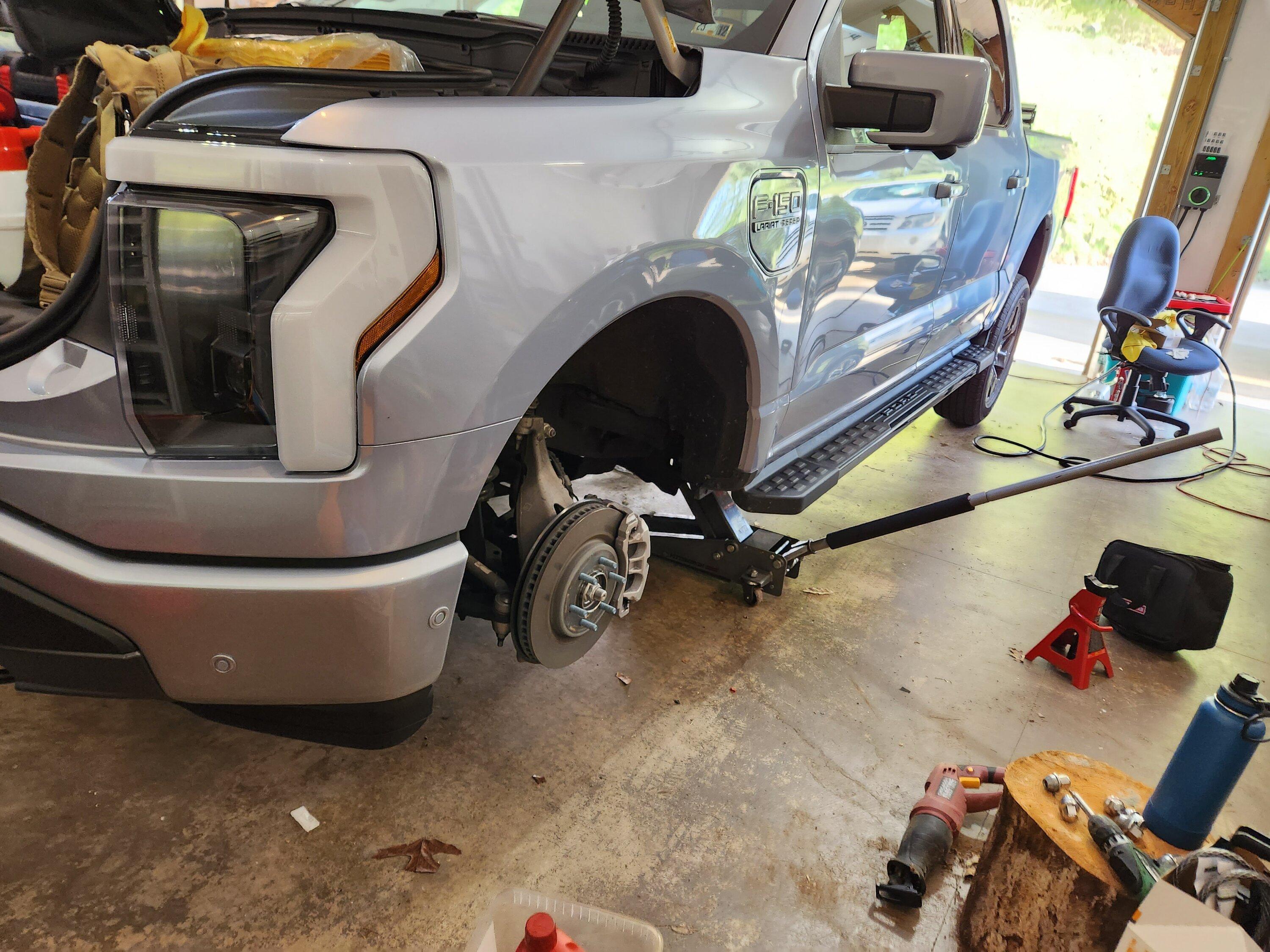 Ford F-150 Lightning How-to DIY: Home Tire Rotation without removing underbody plastic panel shielding 20230513_184514