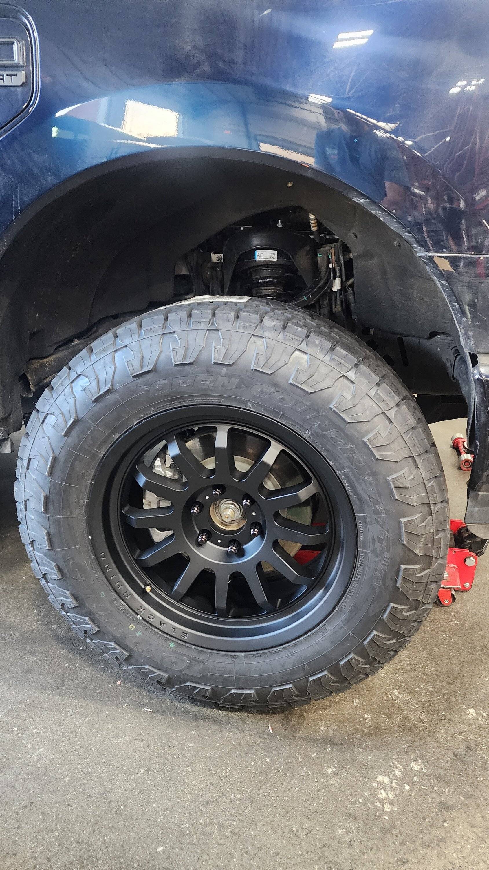 Ford F-150 Lightning Toyo Open Country AT3 EV Tires + Black Rhino Rapid 20x9 wheels +12mm, Rough Country 2" Level + Eibach Adjustable Shocks 20241204_153426