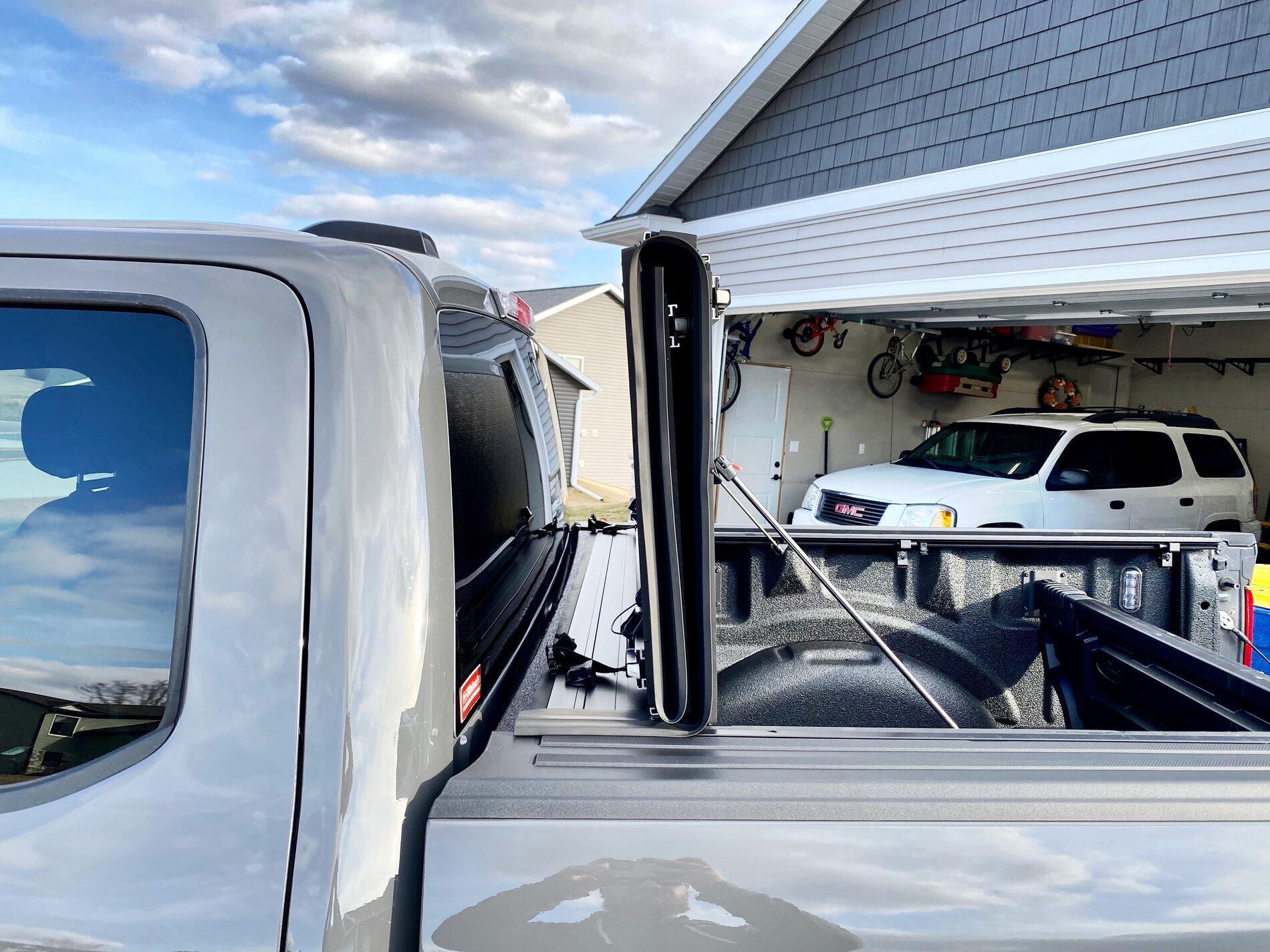 Ford F-150 Lightning Finally got my bed setup: bed liner, tonneau cover, and bed divider. 248A808E-F26B-4A97-BF50-2B33B6F230D1