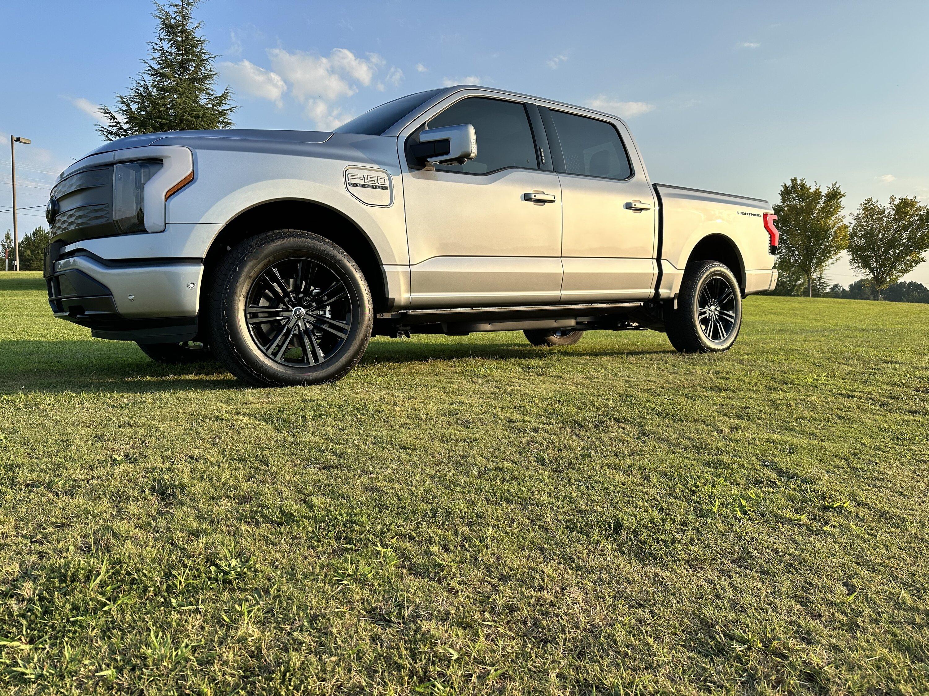 Ford F-150 Lightning Gloss black 20" wheels on my Lightning Lariat with stock AT tires, tints, AMP Power Steps 2EF24E0A-9C76-4B90-BF3E-DB1C15CA16CA