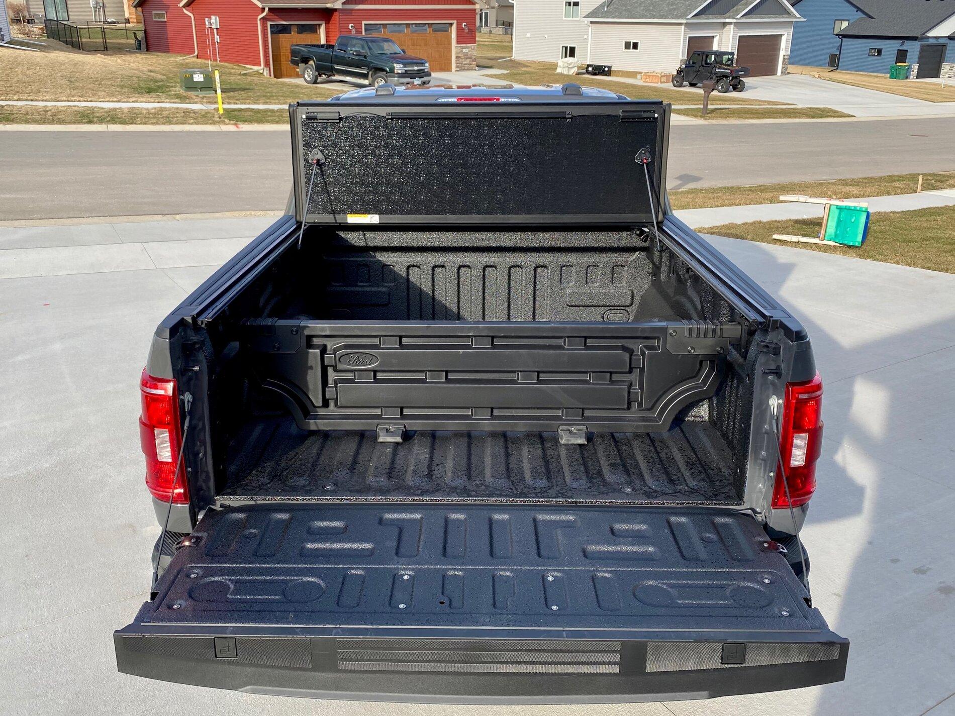 Ford F-150 Lightning Finally got my bed setup: bed liner, tonneau cover, and bed divider. 7A057242-765B-4C3D-8B2D-329A2BBFEA9F