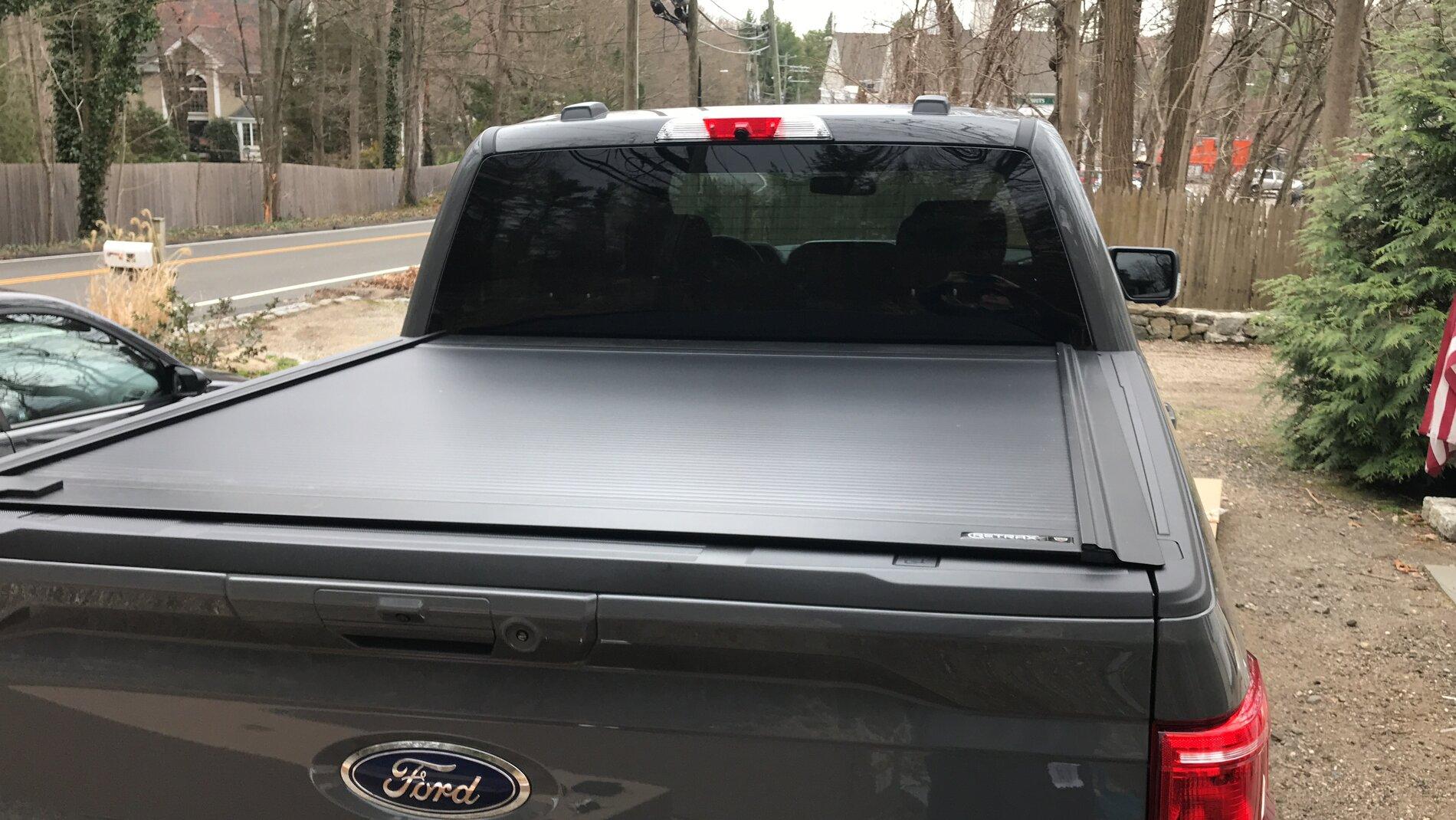 Ford F-150 Lightning Finally got my bed setup: bed liner, tonneau cover, and bed divider. 7DB21C3A-A64E-4E2E-9166-EE3F16864DCF