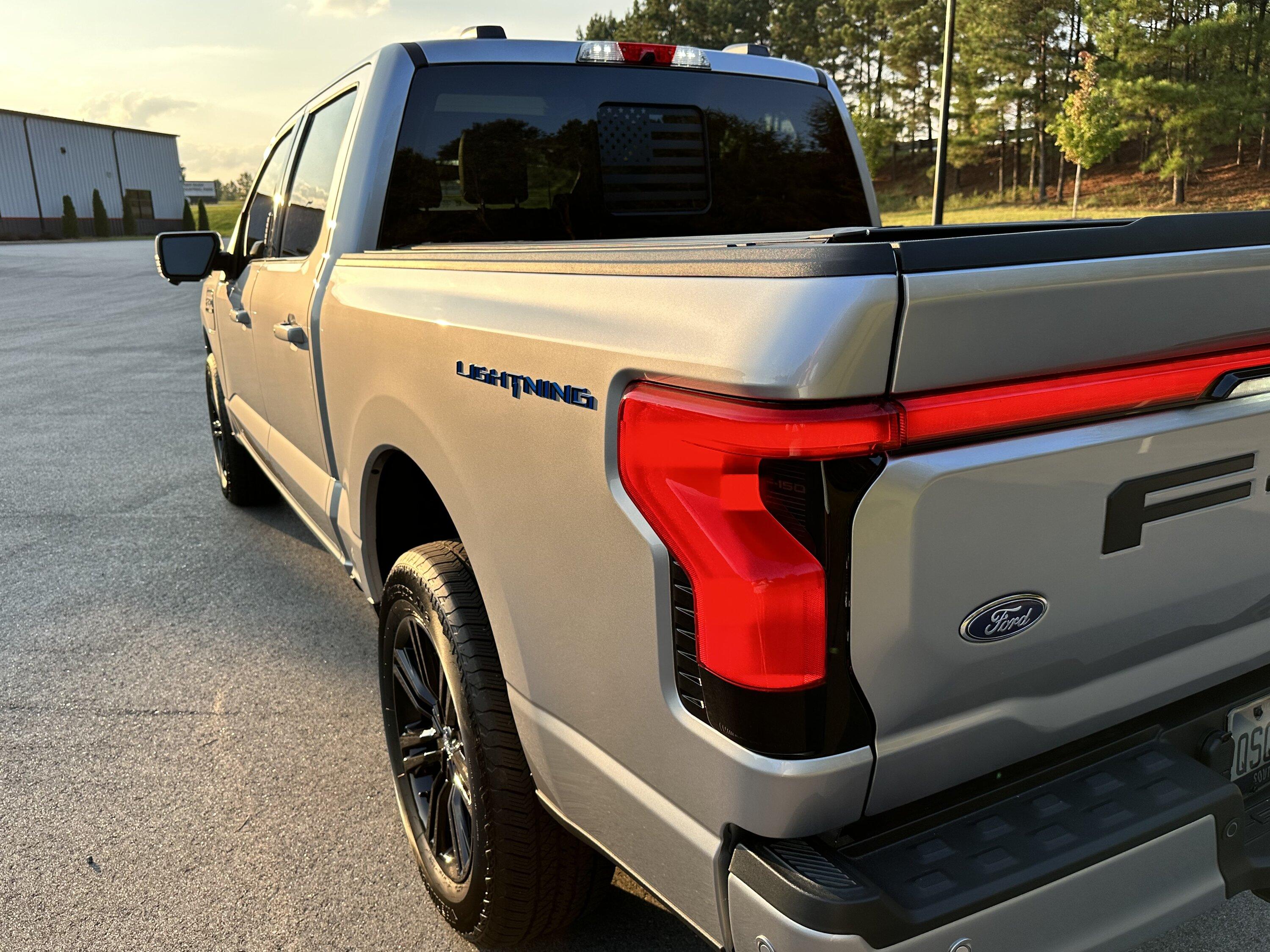 Ford F-150 Lightning Gloss black 20" wheels on my Lightning Lariat with stock AT tires, tints, AMP Power Steps 87C7EEB7-FDB0-461C-BDC4-7203B35BAD03