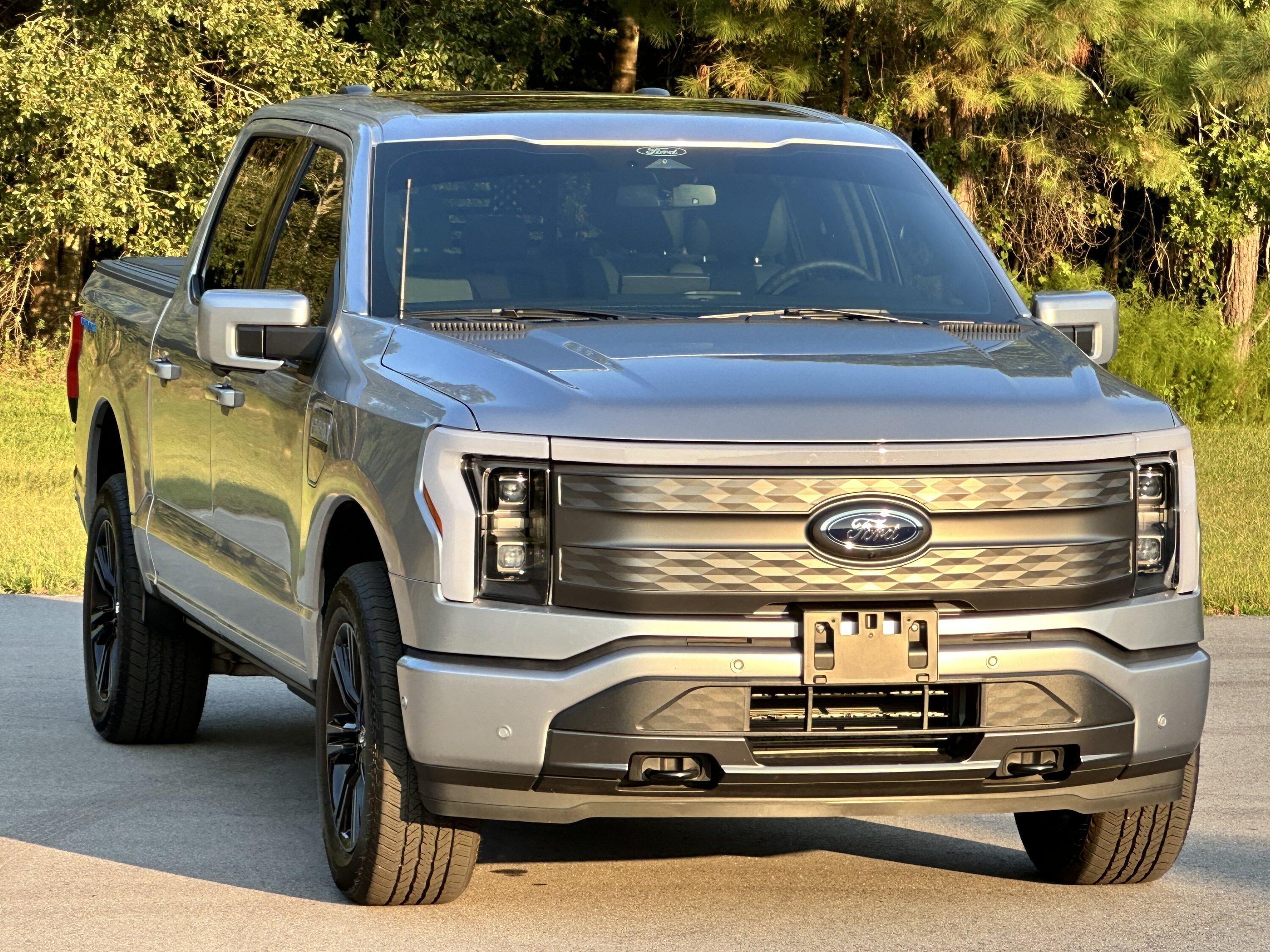 Ford F-150 Lightning Gloss black 20" wheels on my Lightning Lariat with stock AT tires, tints, AMP Power Steps A769AC9E-428E-40A8-92B0-44933C4CD368