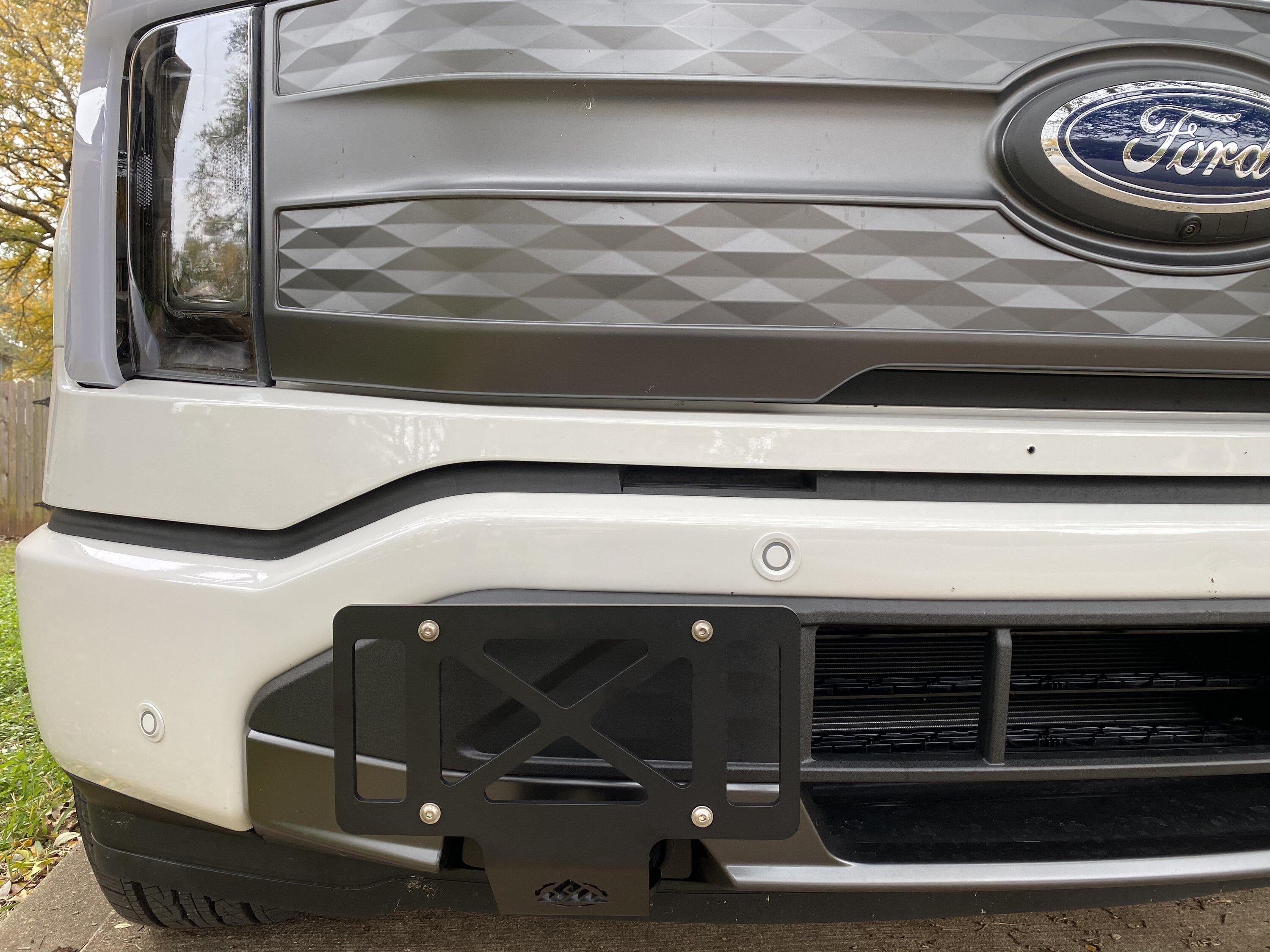 Ford F-150 Lightning Relocate Front License Plate Holder. B799A86E-F19E-4288-8D81-0C8ADD4C28CA