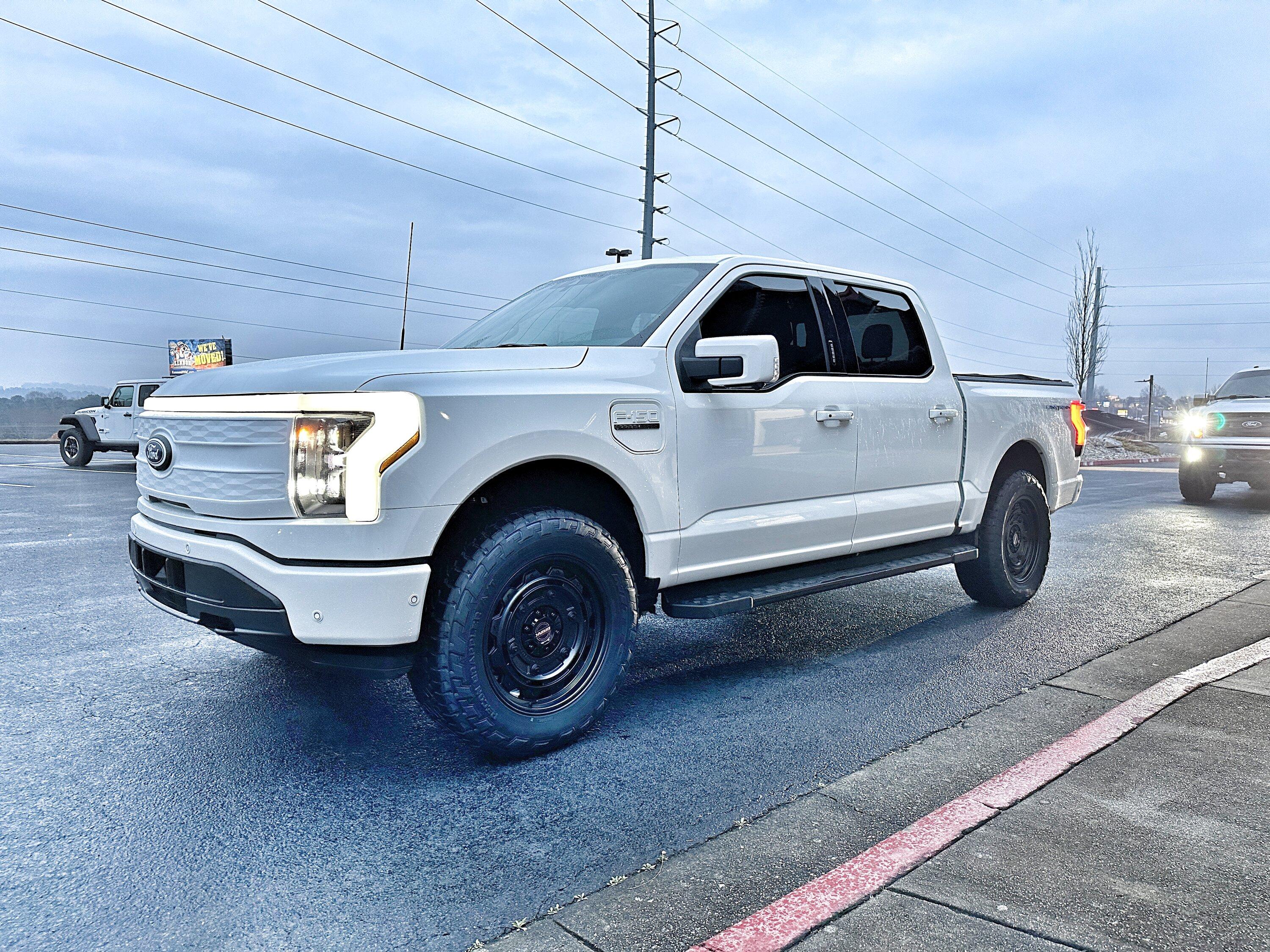 Ford F-150 Lightning Just a little bigger: 2" Readylift Lift Kit, 20" Brink Barracks wheels, Nitto Recon Grappler tires, white grille (Star White Lightning) C7427FE7-B025-4715-AE4E-7CB39C0CE1CD