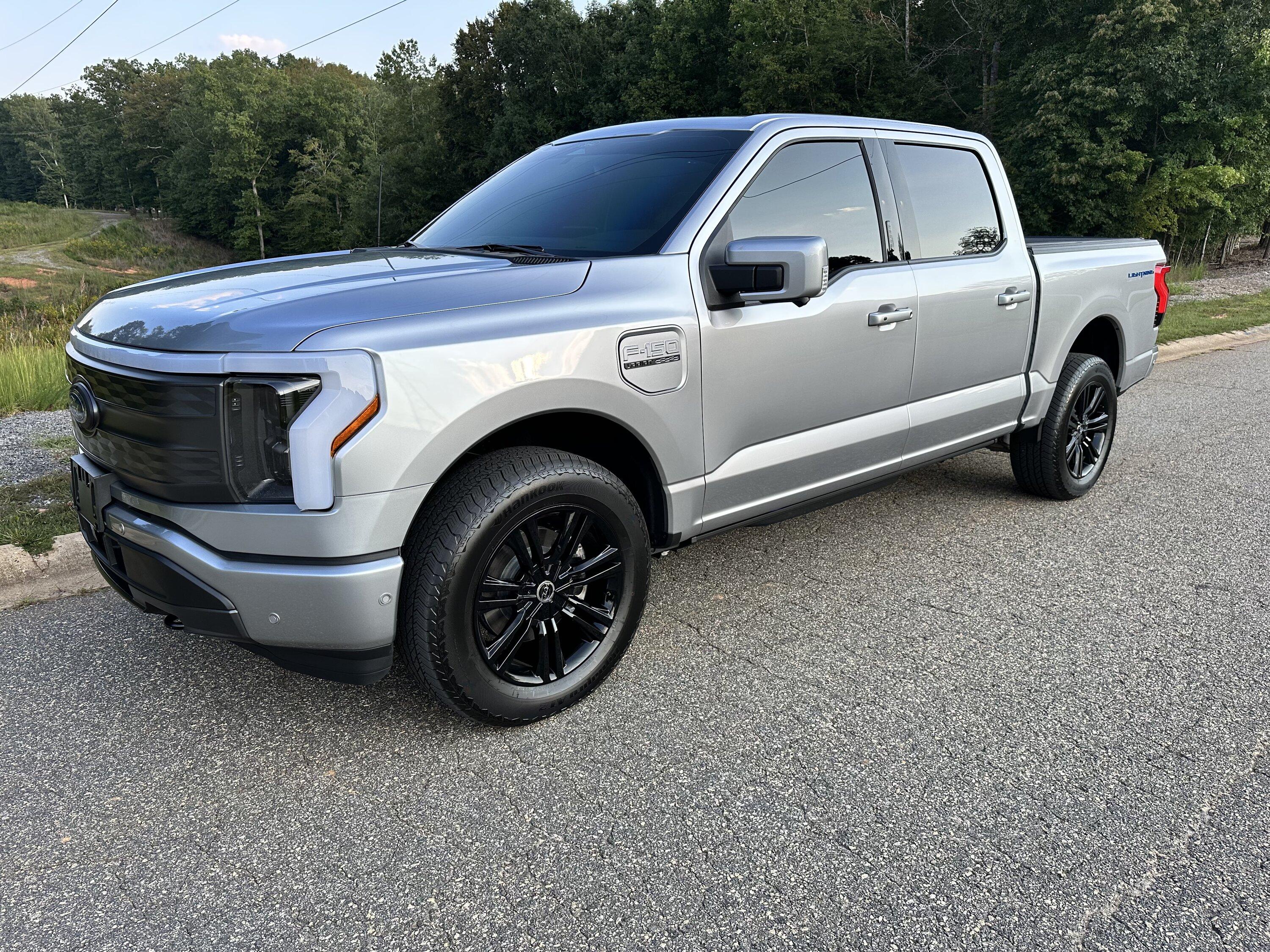 Ford F-150 Lightning Gloss black 20" wheels on my Lightning Lariat with stock AT tires, tints, AMP Power Steps CA4BC0FE-A7E5-4807-A02A-27A132E77C9C