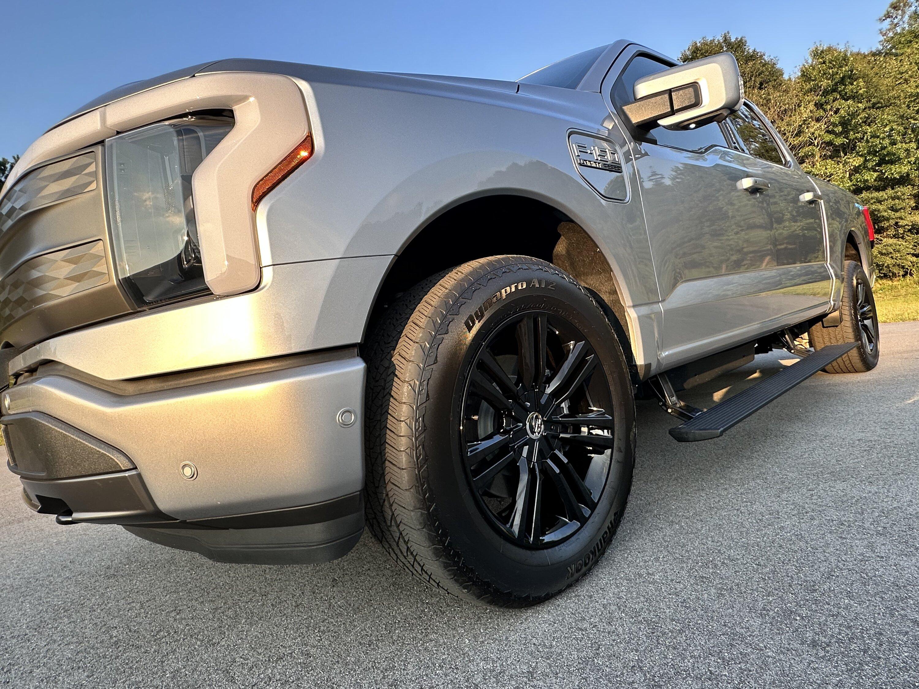 Ford F-150 Lightning Gloss black 20" wheels on my Lightning Lariat with stock AT tires, tints, AMP Power Steps DCD60B5B-4464-4DE5-A956-EC973C88FB0D