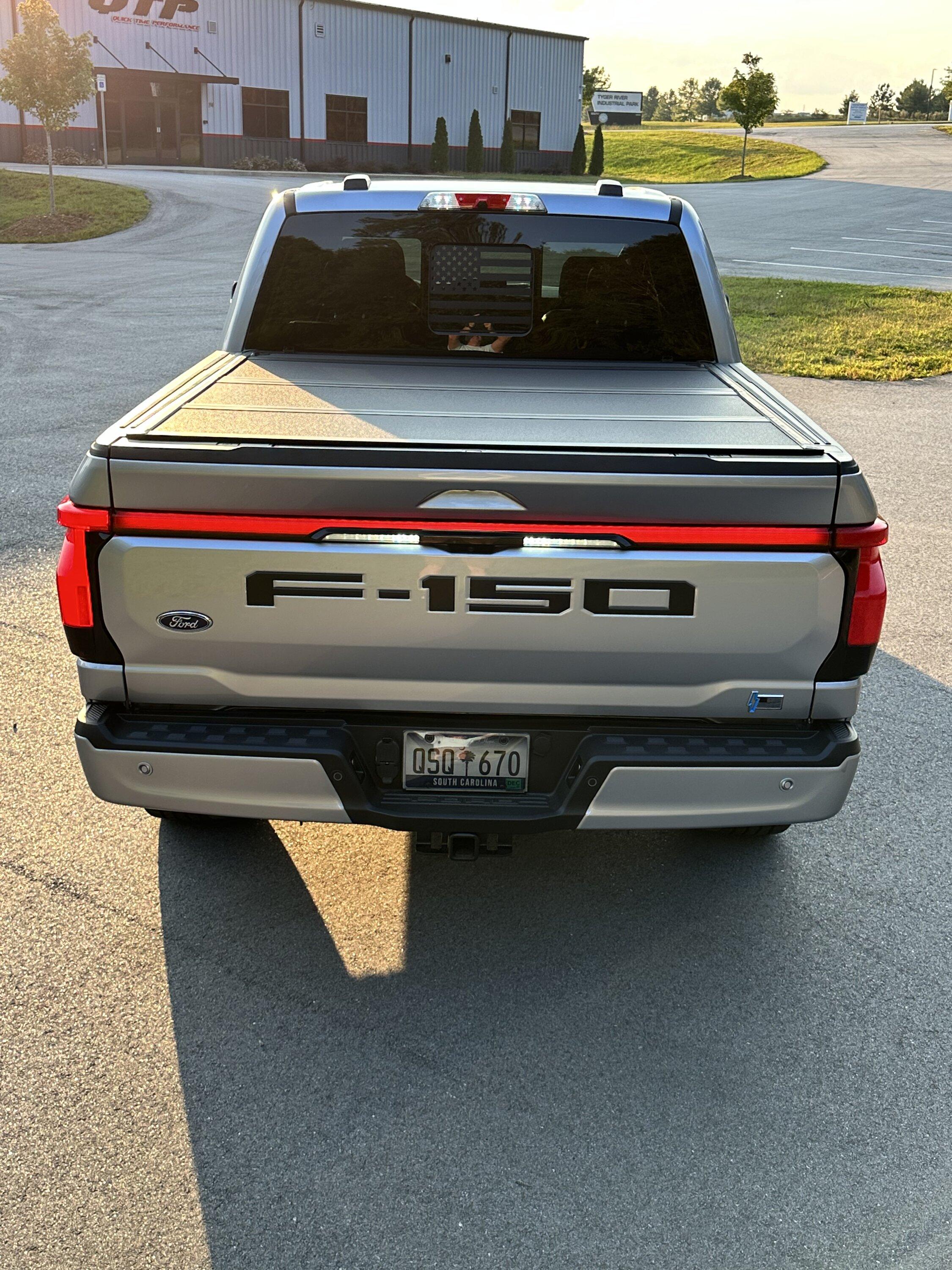 Ford F-150 Lightning Gloss black 20" wheels on my Lightning Lariat with stock AT tires, tints, AMP Power Steps F8B7CE31-BF9A-4F97-A0E4-AAD116EAEEB3