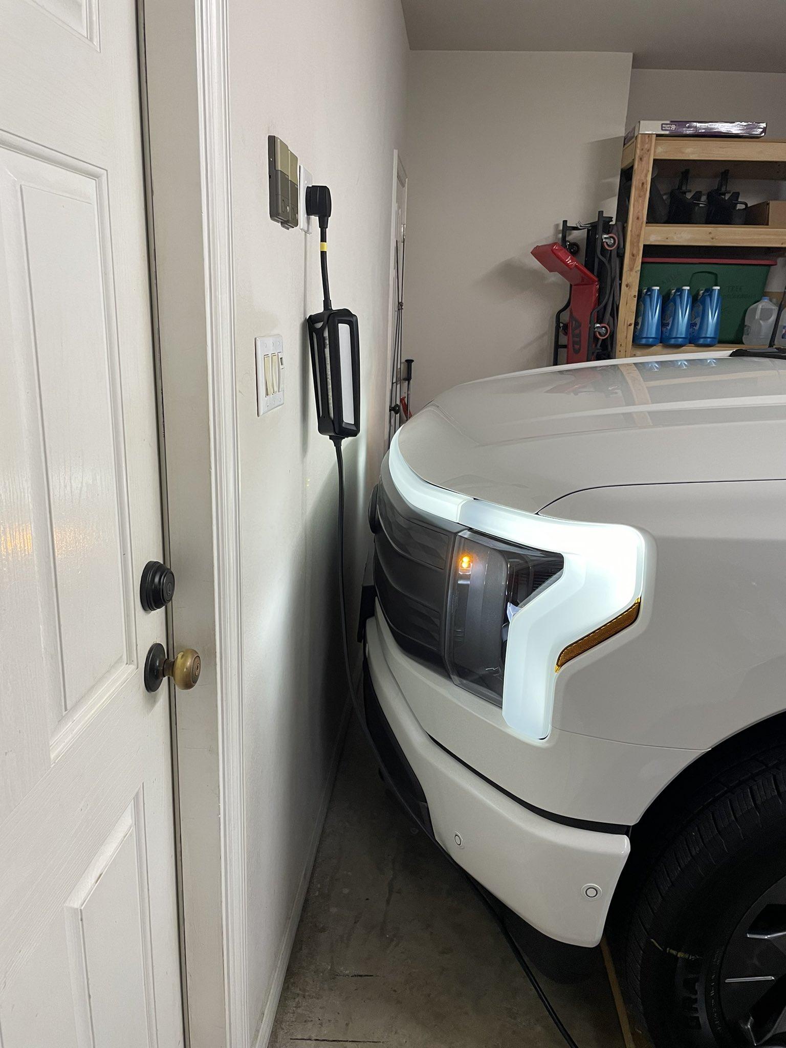 Ford F-150 Lightning Sad Day, our great new Lightning is physically a bad fit for garage ...  (dumb dumb dumb) FVkpBm3XoAIm9fh