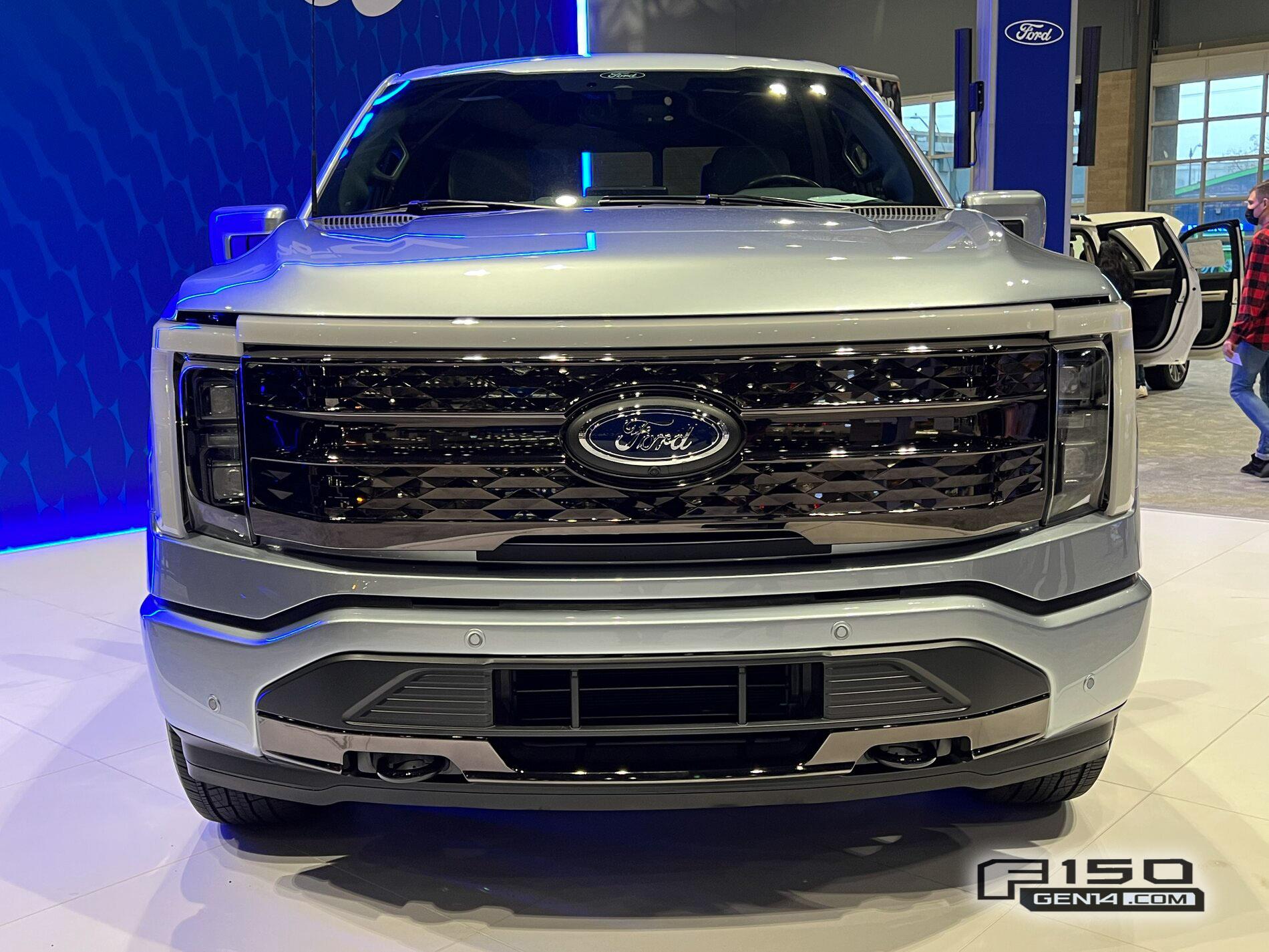 Ford F-150 Lightning F-150 Lightning (in Iced Blue Silver) at Seattle Auto Show Iced Blue Silver F-150 Lightning Platinum EV Pickup Truck 1