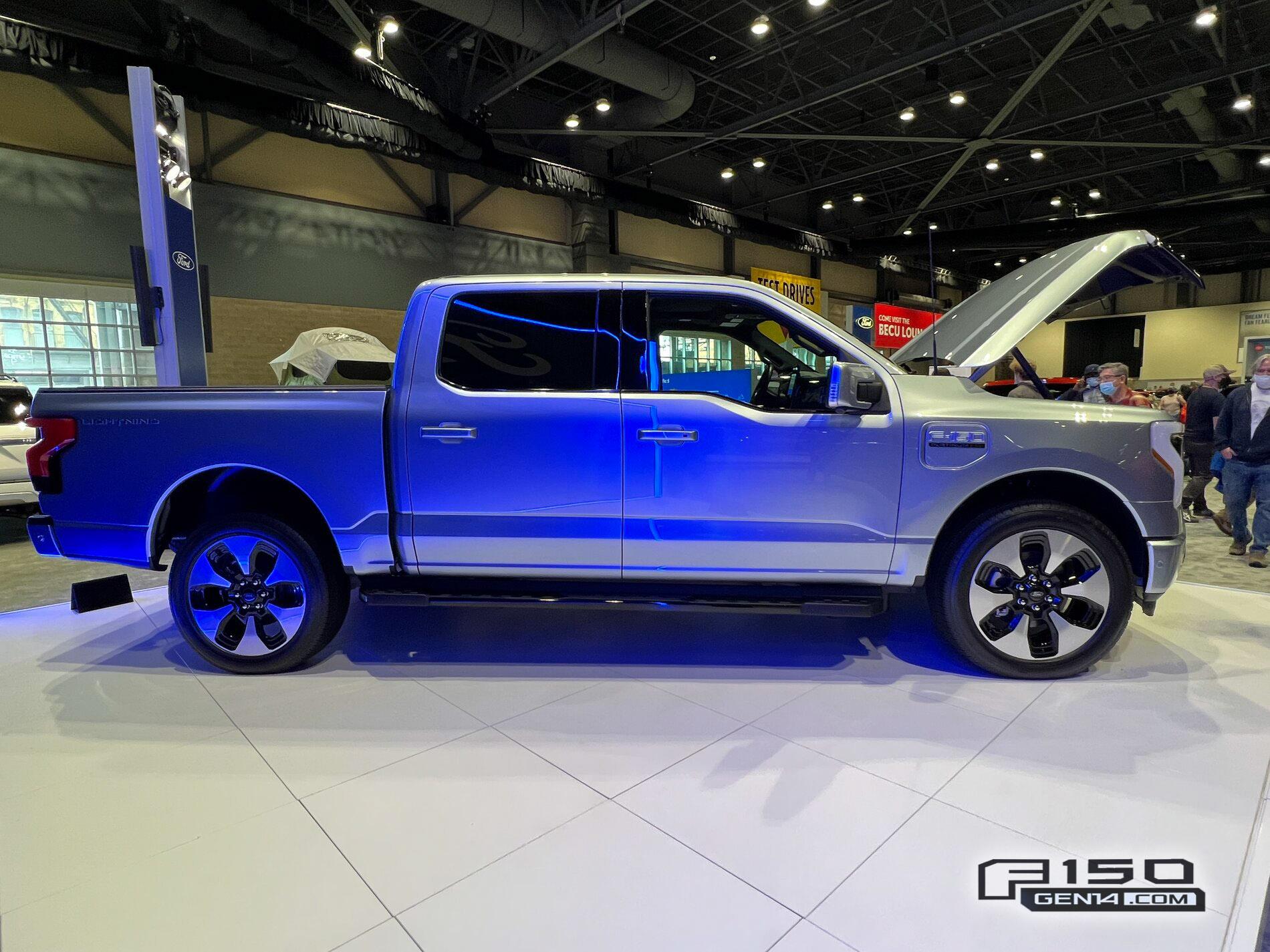 Ford F-150 Lightning F-150 Lightning (in Iced Blue Silver) at Seattle Auto Show Iced Blue Silver F-150 Lightning Platinum EV Pickup Truck 2