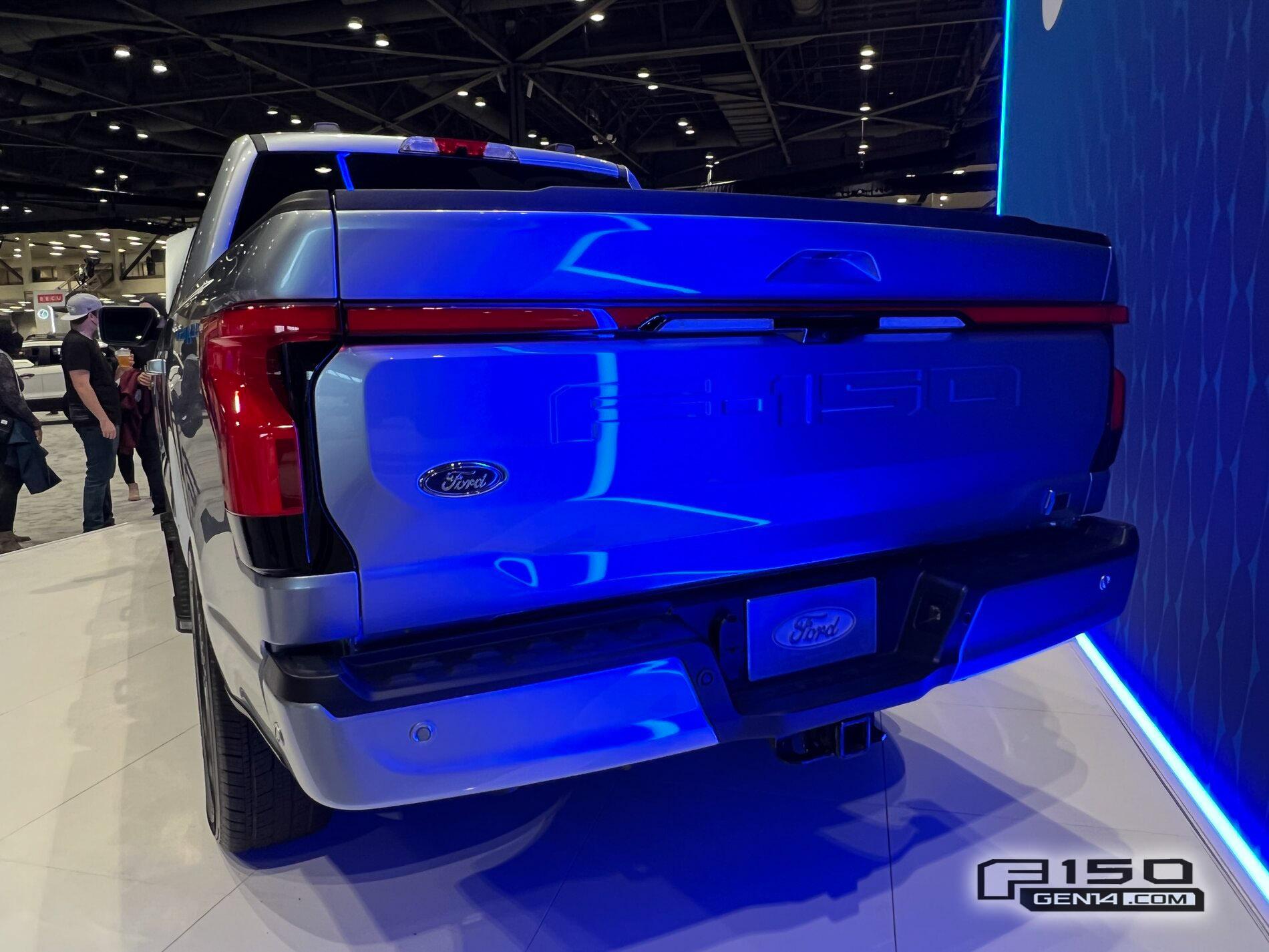 Ford F-150 Lightning F-150 Lightning (in Iced Blue Silver) at Seattle Auto Show Iced Blue Silver F-150 Lightning Platinum EV Pickup Truck 3