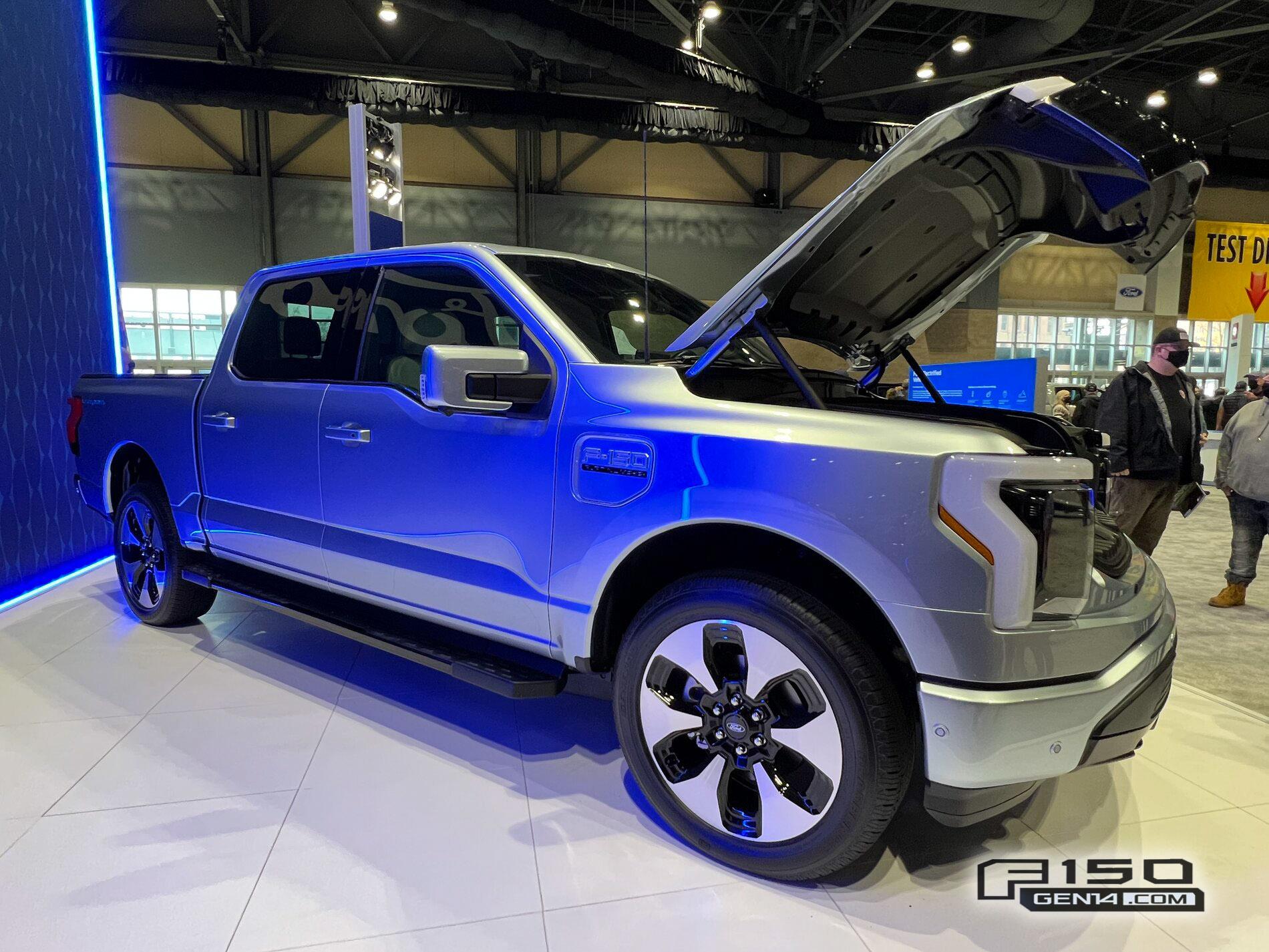 Ford F-150 Lightning F-150 Lightning (in Iced Blue Silver) at Seattle Auto Show Iced Blue Silver F-150 Lightning Platinum EV Pickup Truck 5