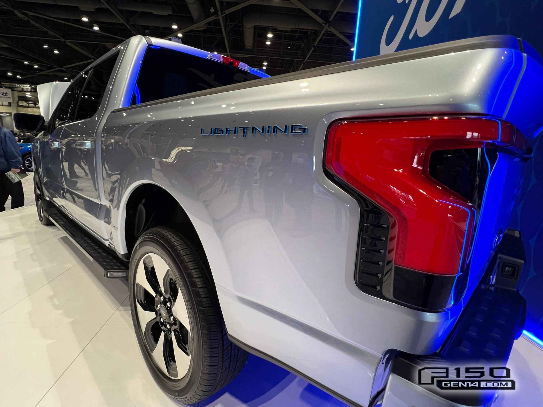 Ford F-150 Lightning F-150 Lightning (in Iced Blue Silver) at Seattle Auto Show Iced Blue Silver F-150 Lightning Platinum EV Pickup Truck 7