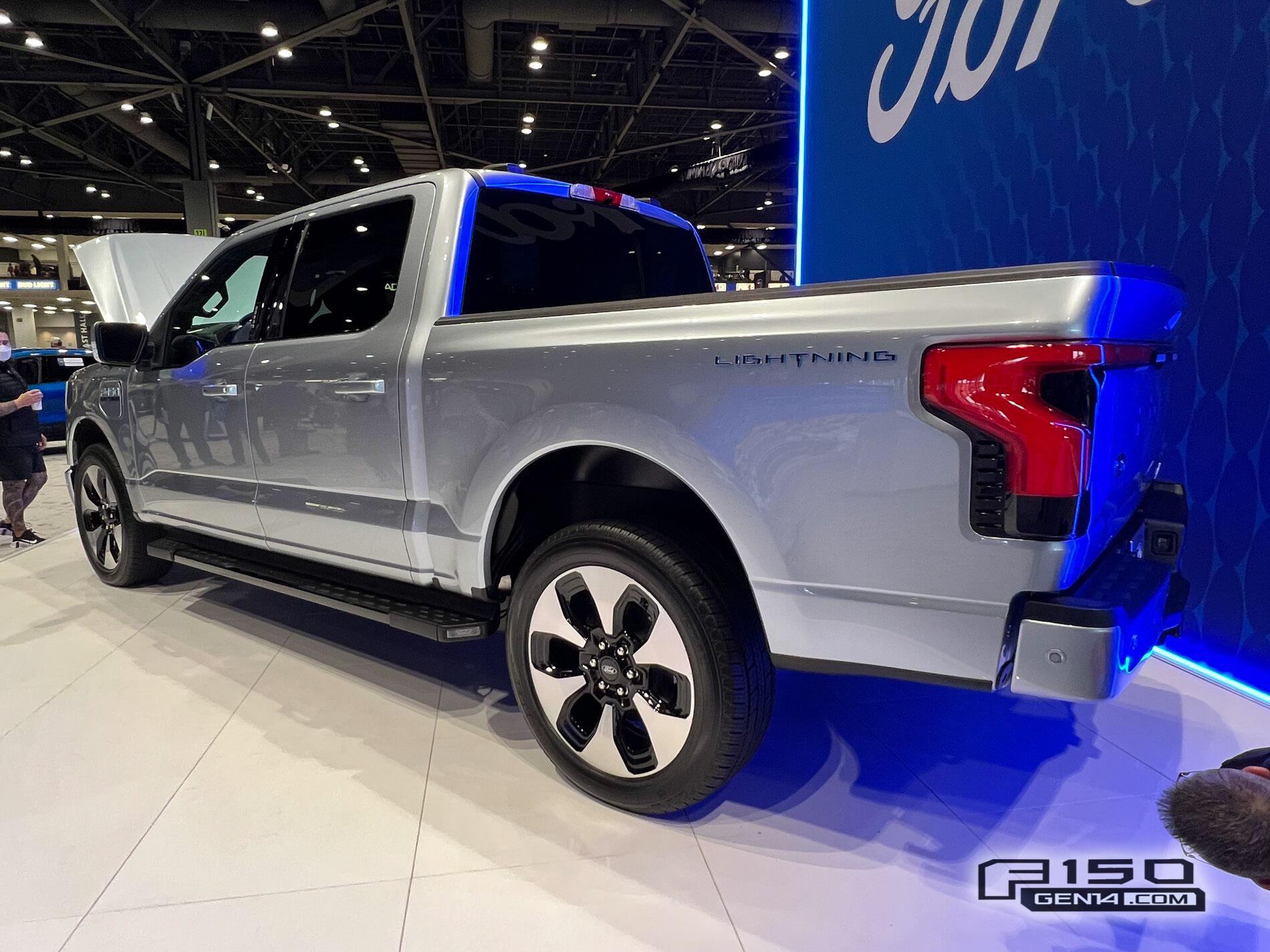 Ford F-150 Lightning F-150 Lightning (in Iced Blue Silver) at Seattle Auto Show Iced Blue Silver F-150 Lightning Platinum EV Pickup Truck 9