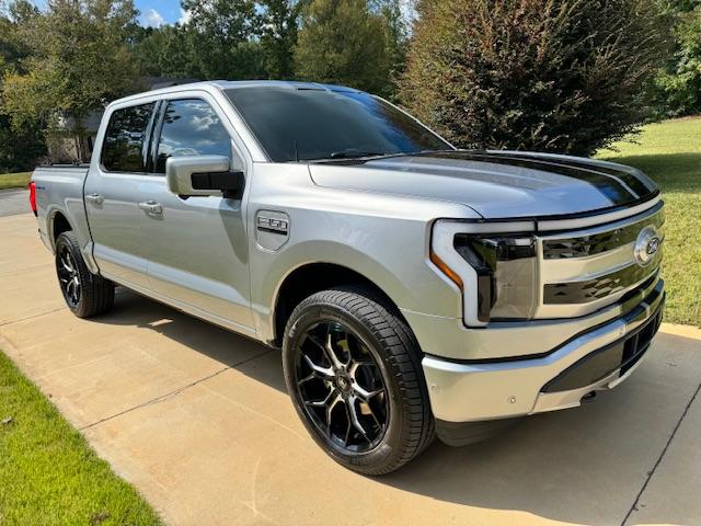 Ford F-150 Lightning Gloss black 20" wheels on my Lightning Lariat with stock AT tires, tints, AMP Power Steps IMG_0036