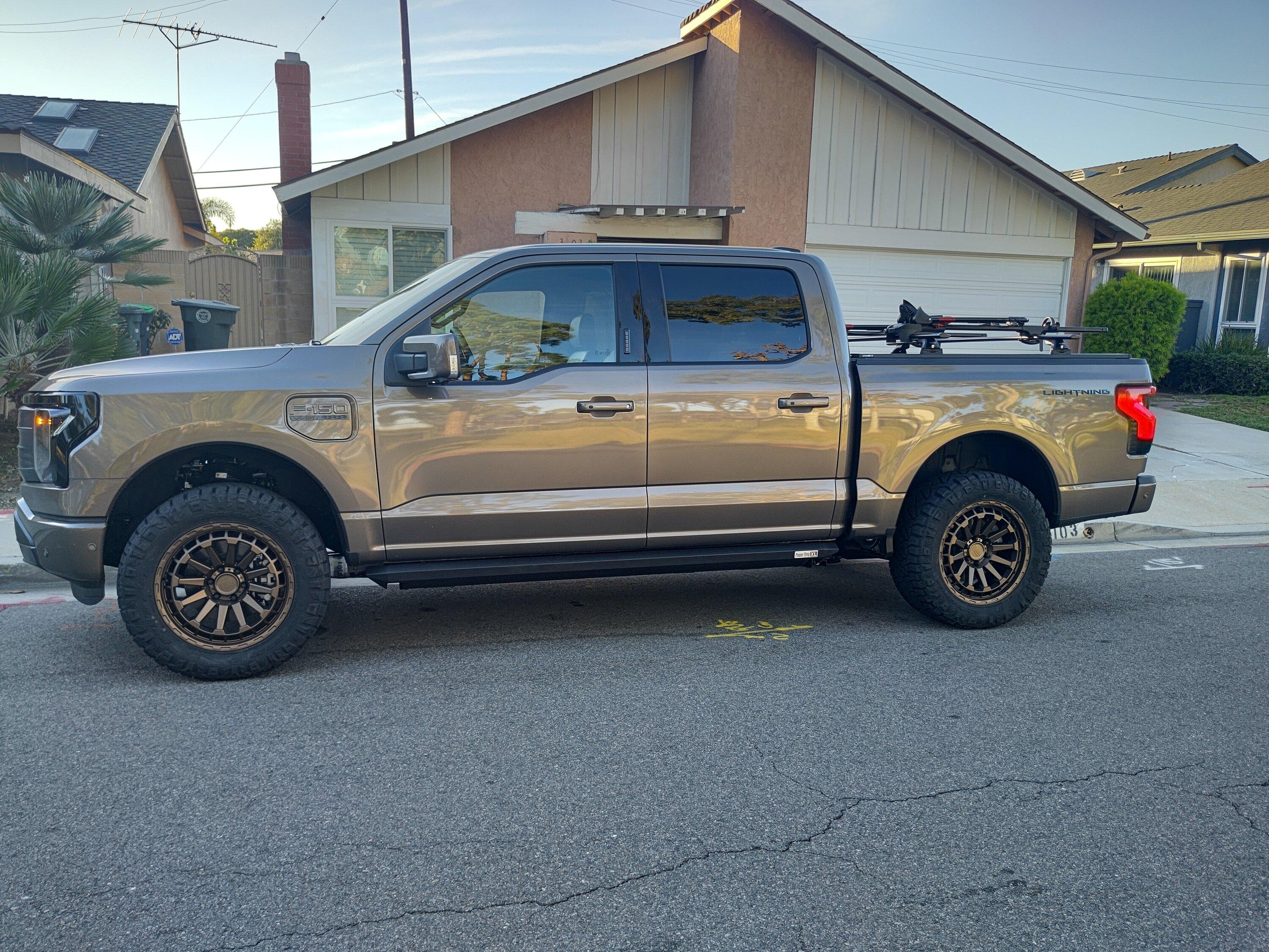 Ford F-150 Lightning Stone Gray Lightning leveled on 20" Black Rhino wheels, blacked out LED light bar, cross bars, bike rack IMG_20221114_155046