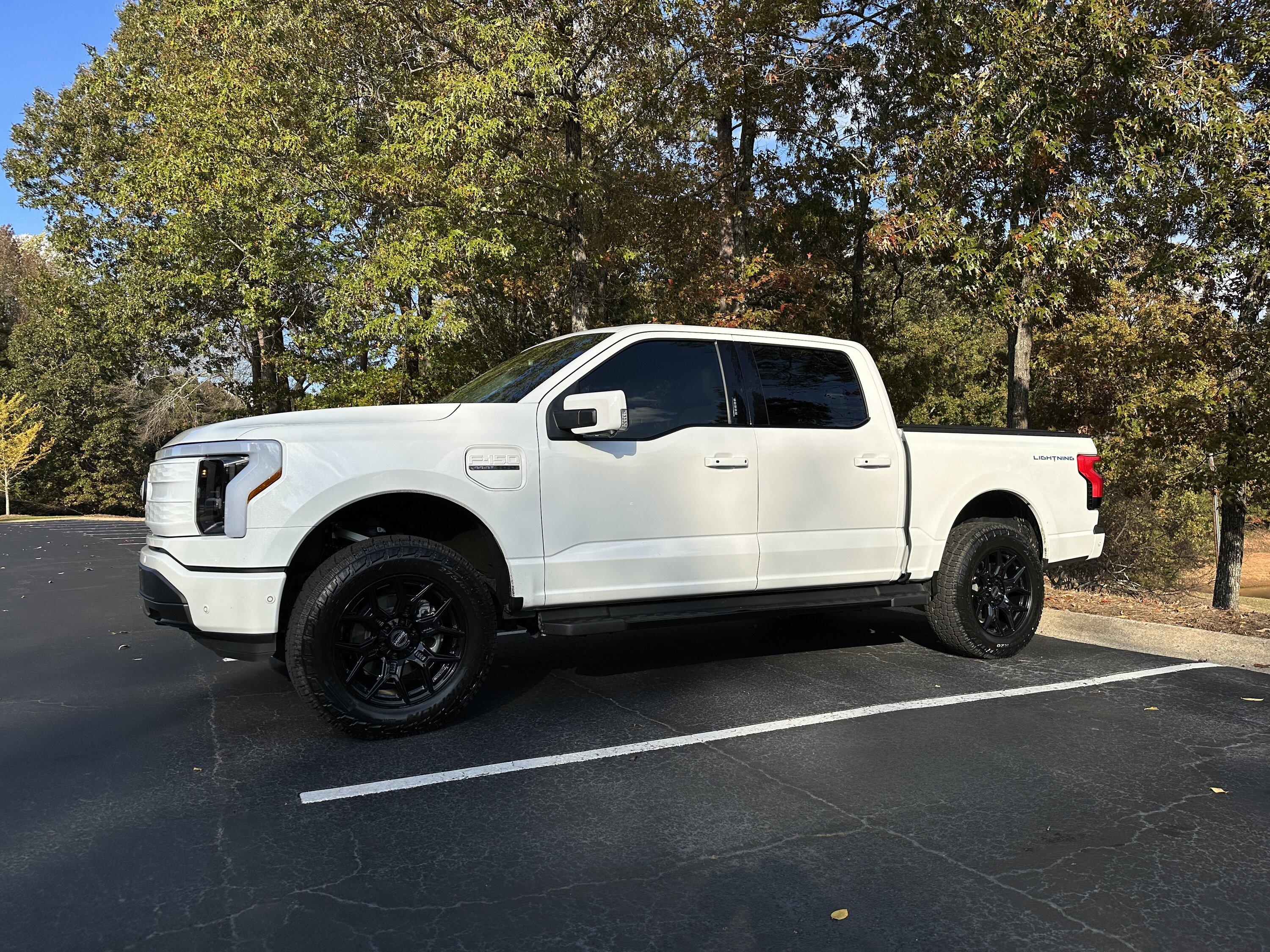 Ford F-150 Lightning Just a little bigger: 2" Readylift Lift Kit, 20" Brink Barracks wheels, Nitto Recon Grappler tires, white grille (Star White Lightning) IMG_4041