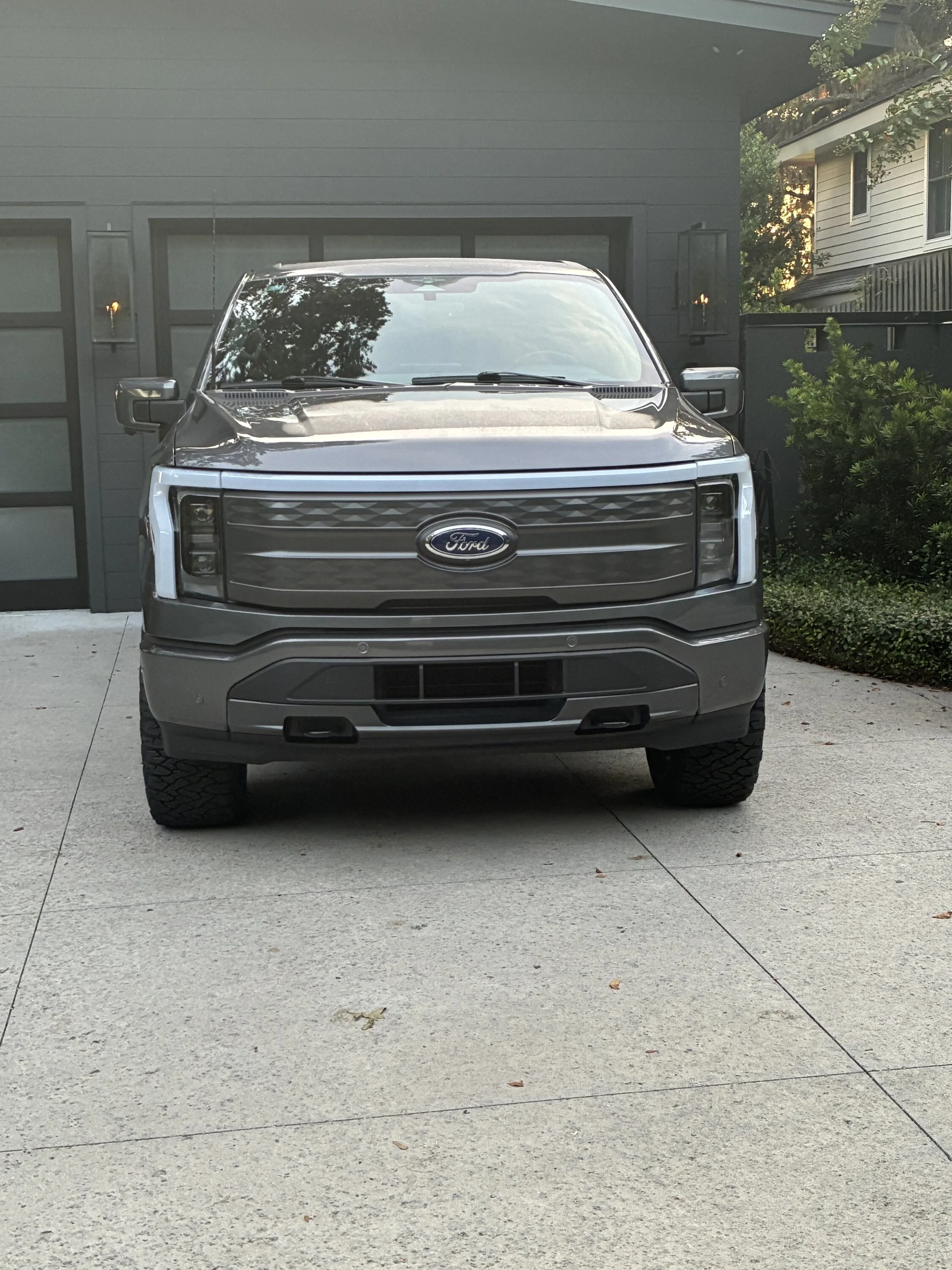 Ford F-150 Lightning Pics and range info: Eibach 2.6” leveling shock and KO3 295/60/20 tires on Lariat ER IMG_4654