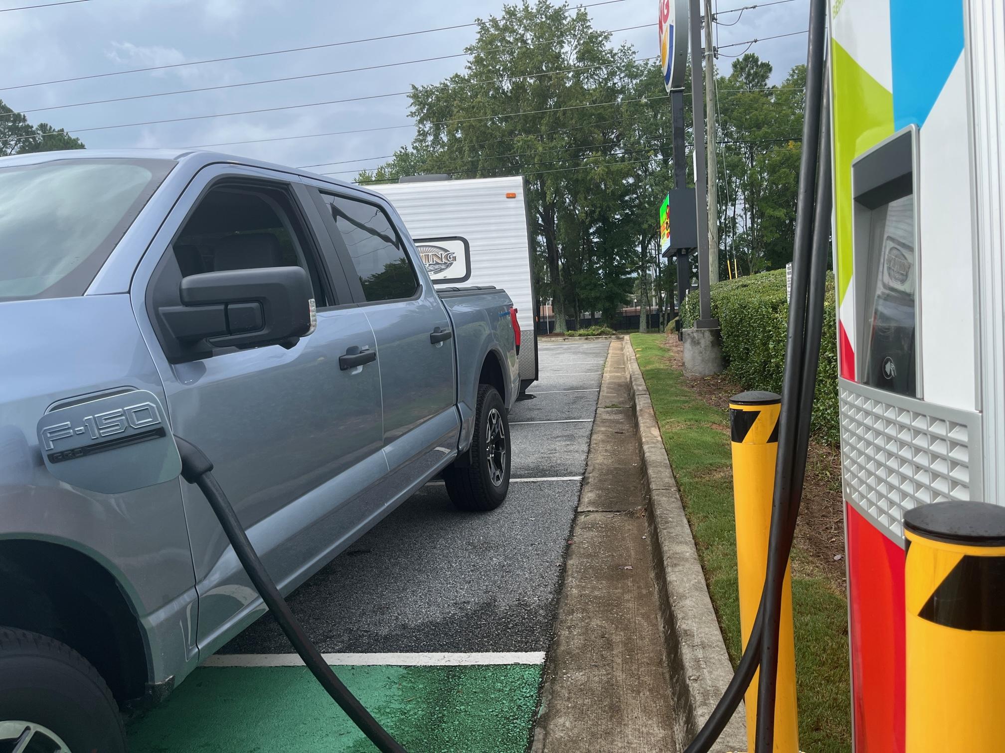 Ford F-150 Lightning 250 mile trip report: Lightning PRO - TOWING 3,000lb Powered Camper... LIGHTNING CHARGING CHARGEPOINT WITH CAMPER.JPG