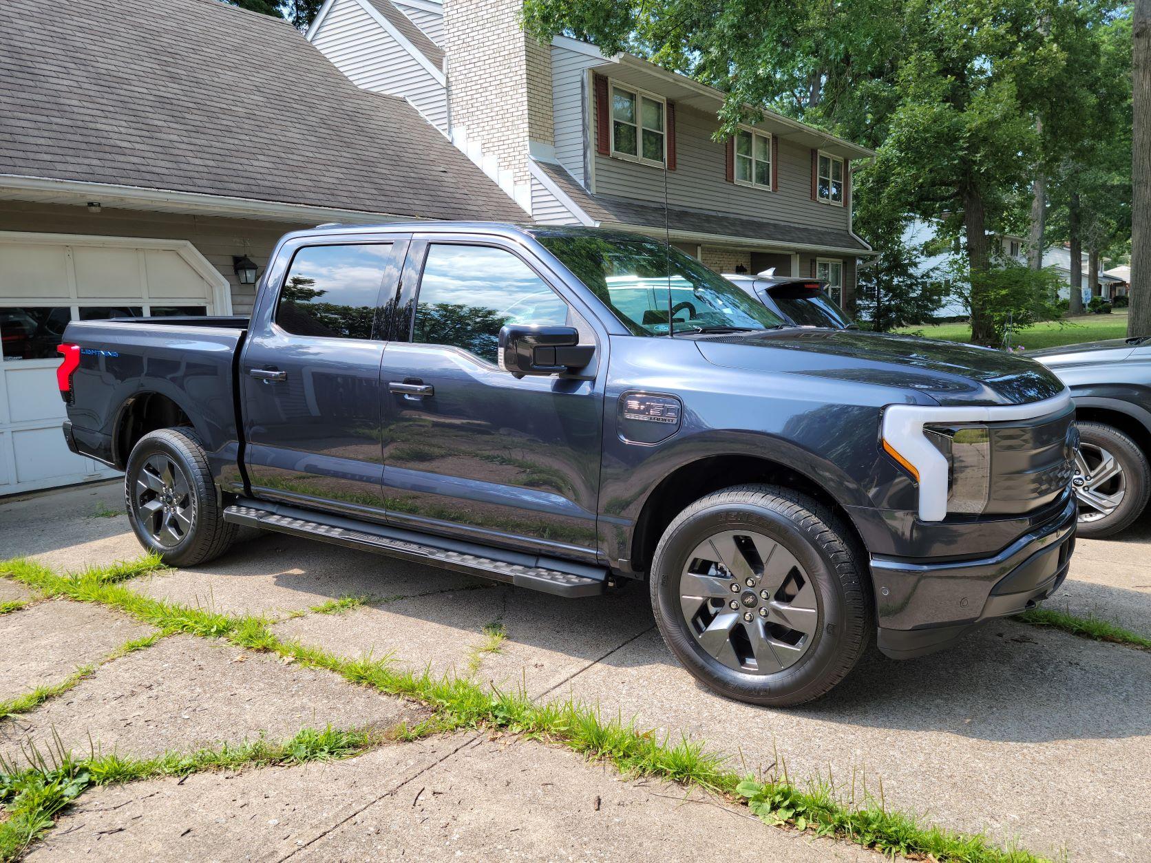 Ford F-150 Lightning ✅ 5/30 Lightning Build Week Group Lightning front passenger side.JPG