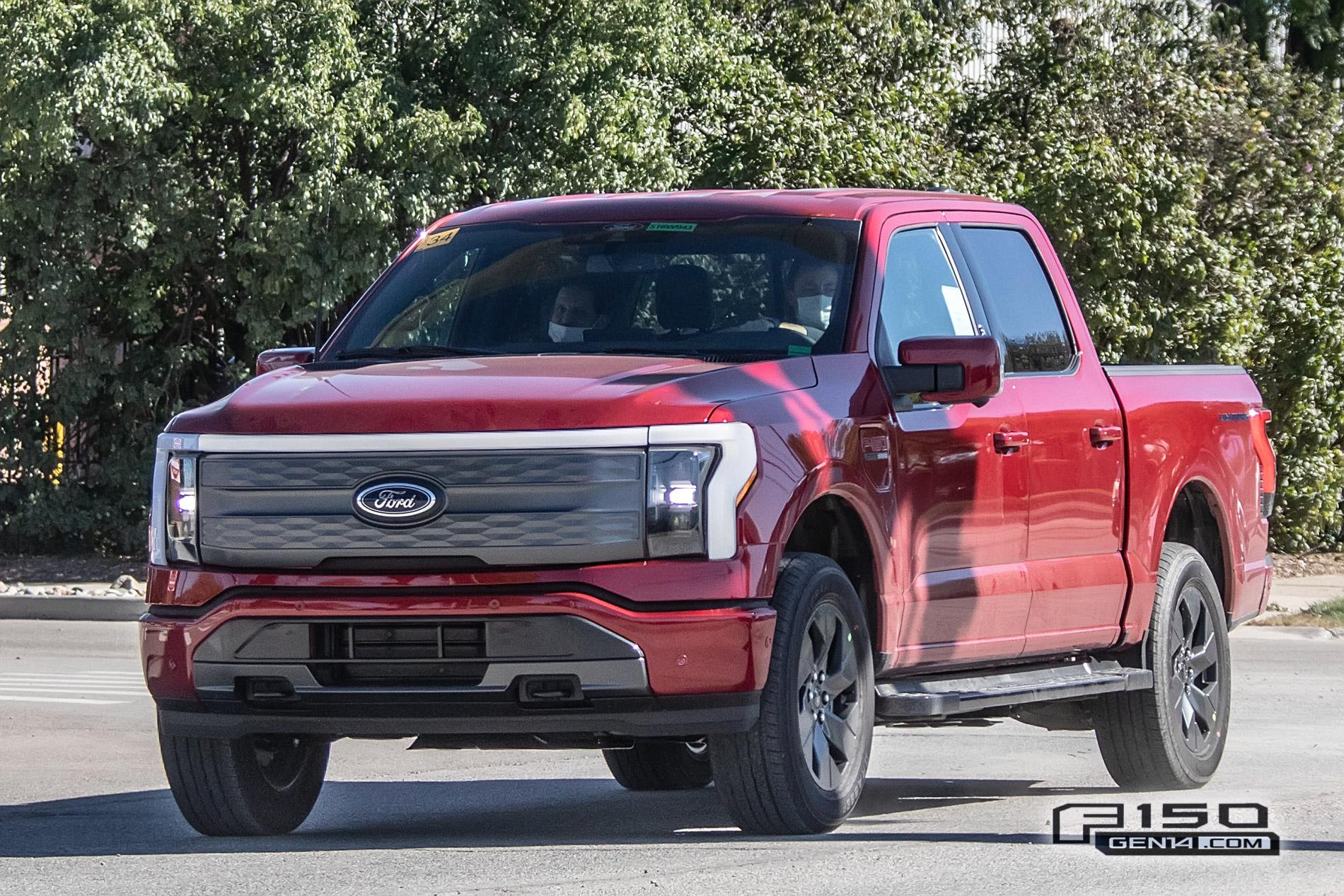 Ford F-150 Lightning F-150 Lightning Platinum (Iconic Silver) & Lariat (Rapid Red) Spotted On Public Roads Production Rapid Red 2022 F150 Lightning Lariat EV Pickup Truck 2