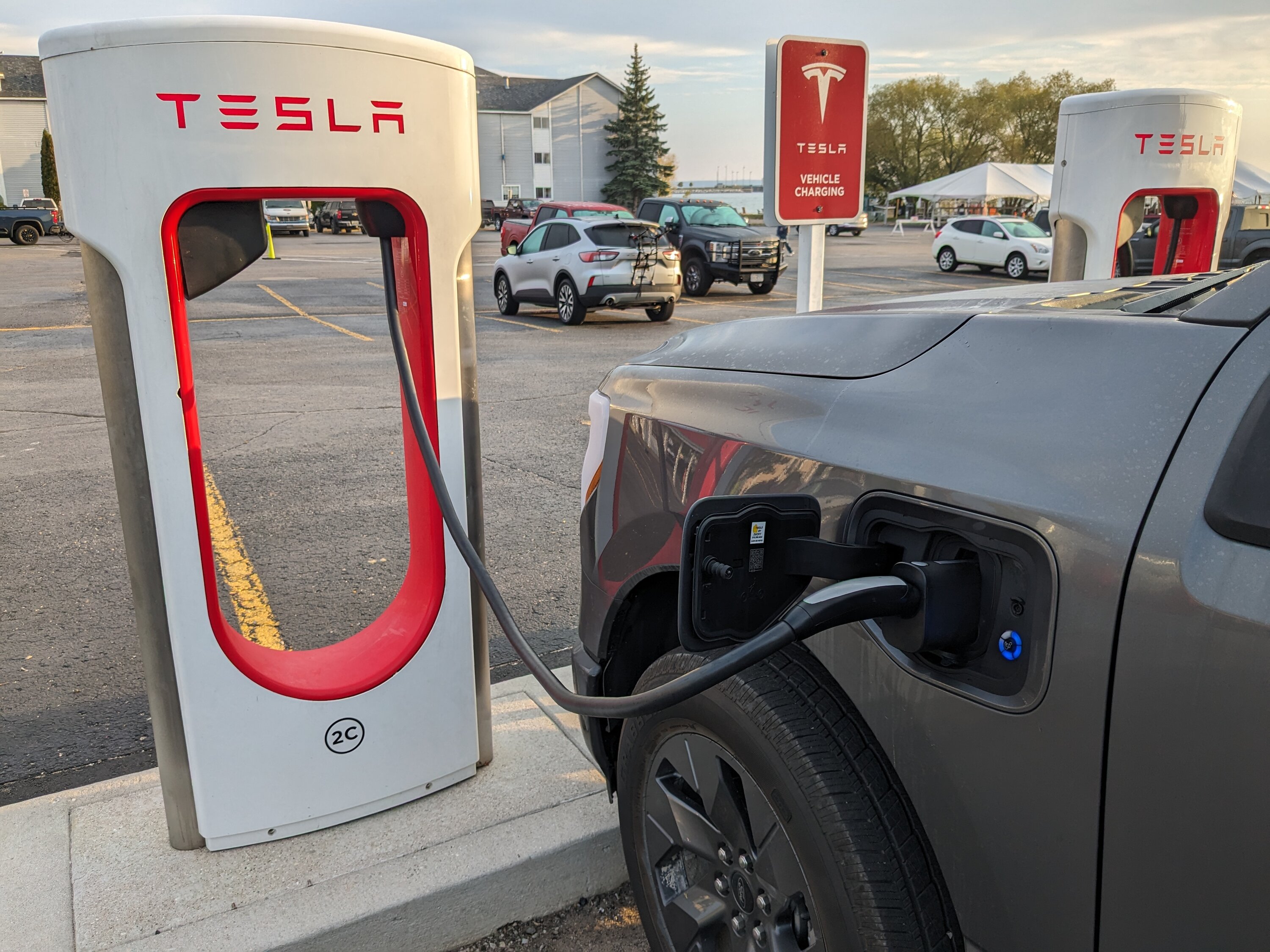 Tesla Starts Retrofitting Superchargers With Magic Dock to Allow Other EVs  to Charge