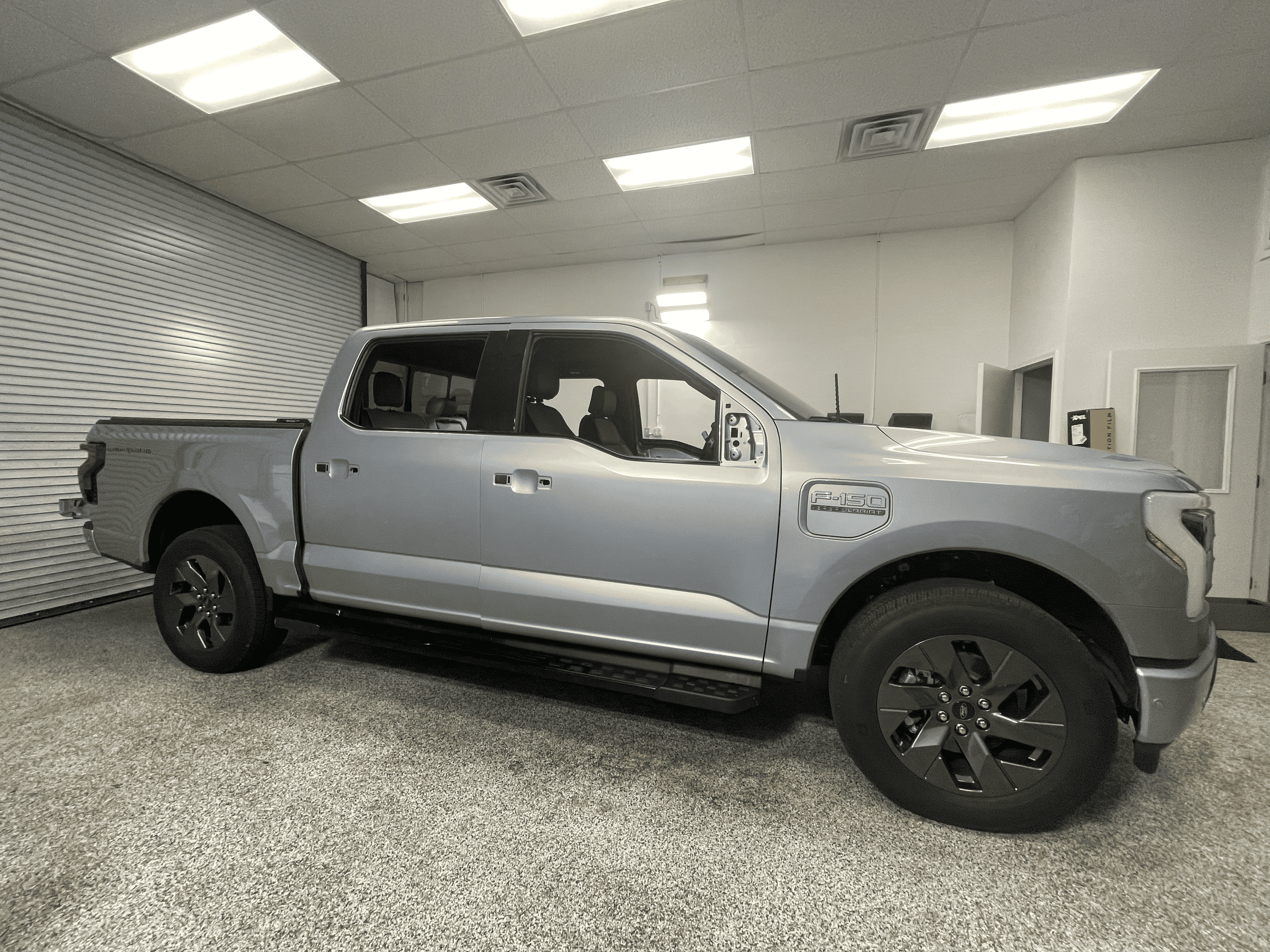 Ford F-150 Lightning Iced Blue Silver Lightning Build. Mods: PPF matte finish, Line-X, gloss black painted grille, black wrapped roof, wheels tempImage3lngfs