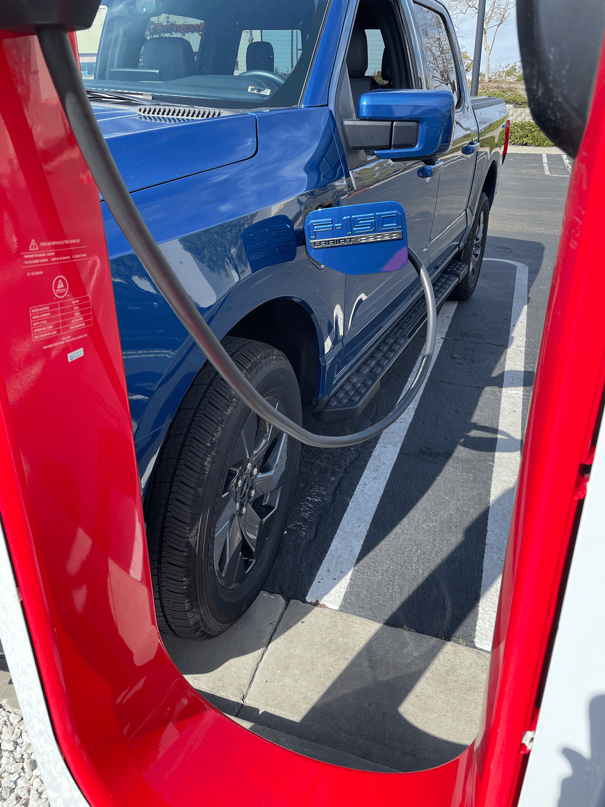 Ford F-150 Lightning Photos from new Tesla Supercharging station w/ new charger placement (for trucks) tempImageBa6J7w