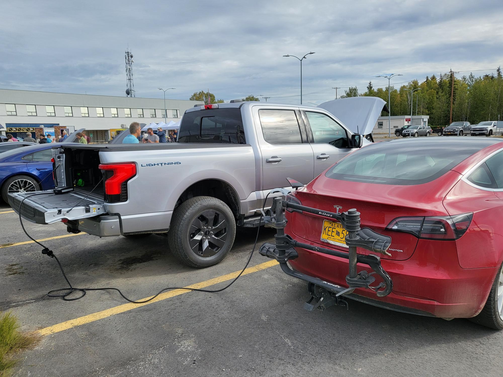 Ford F-150 Lightning Being asked to stop and chat about the Lightning Tesla Charge